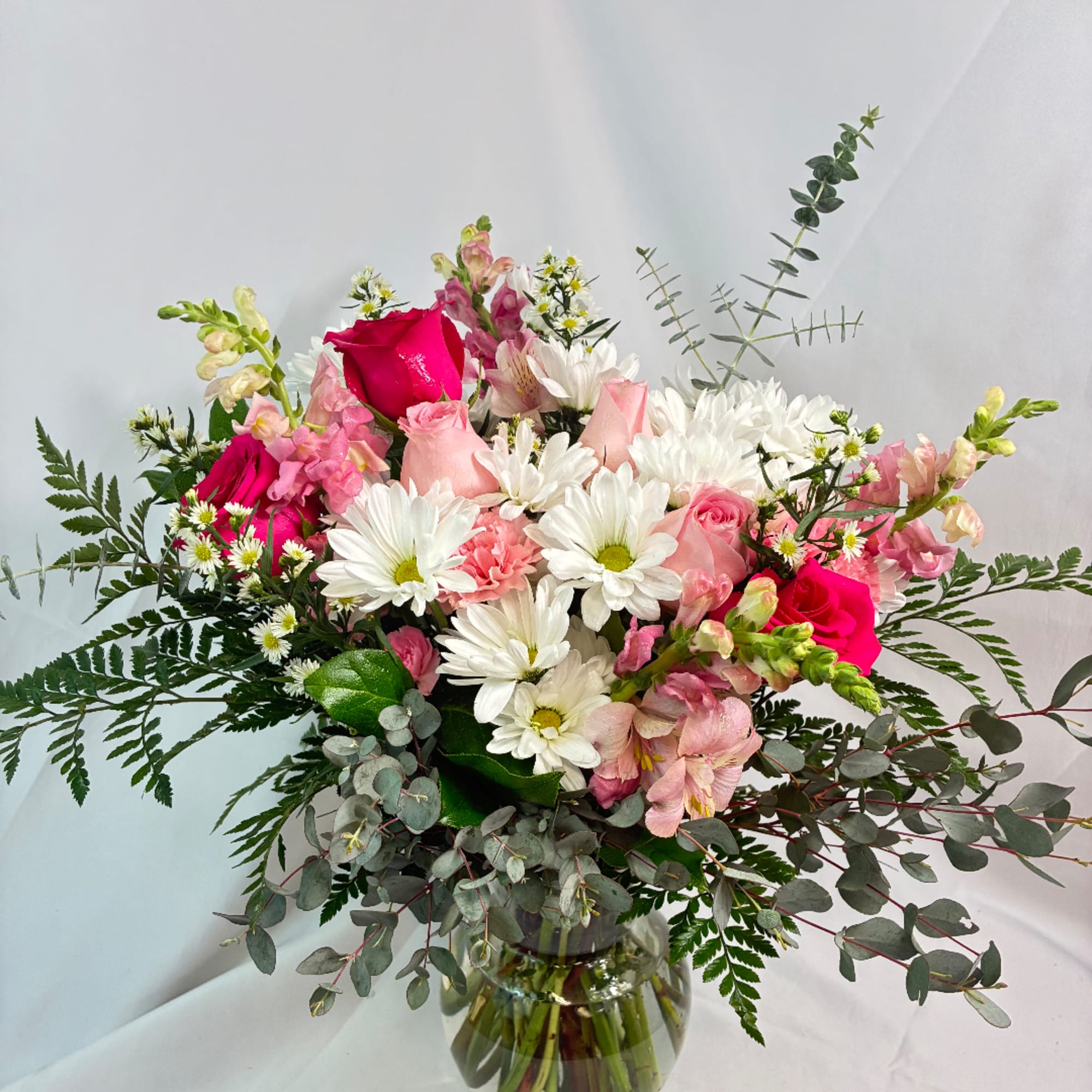 Pink and white mixed bouquet in a glass vase
