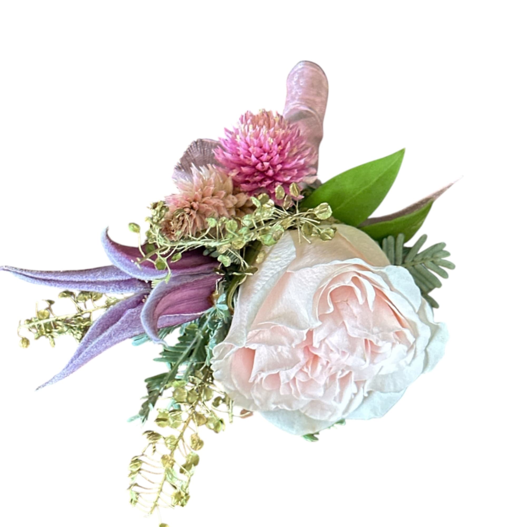 Small pink and purple floral corsage with a pale rose and ribbon