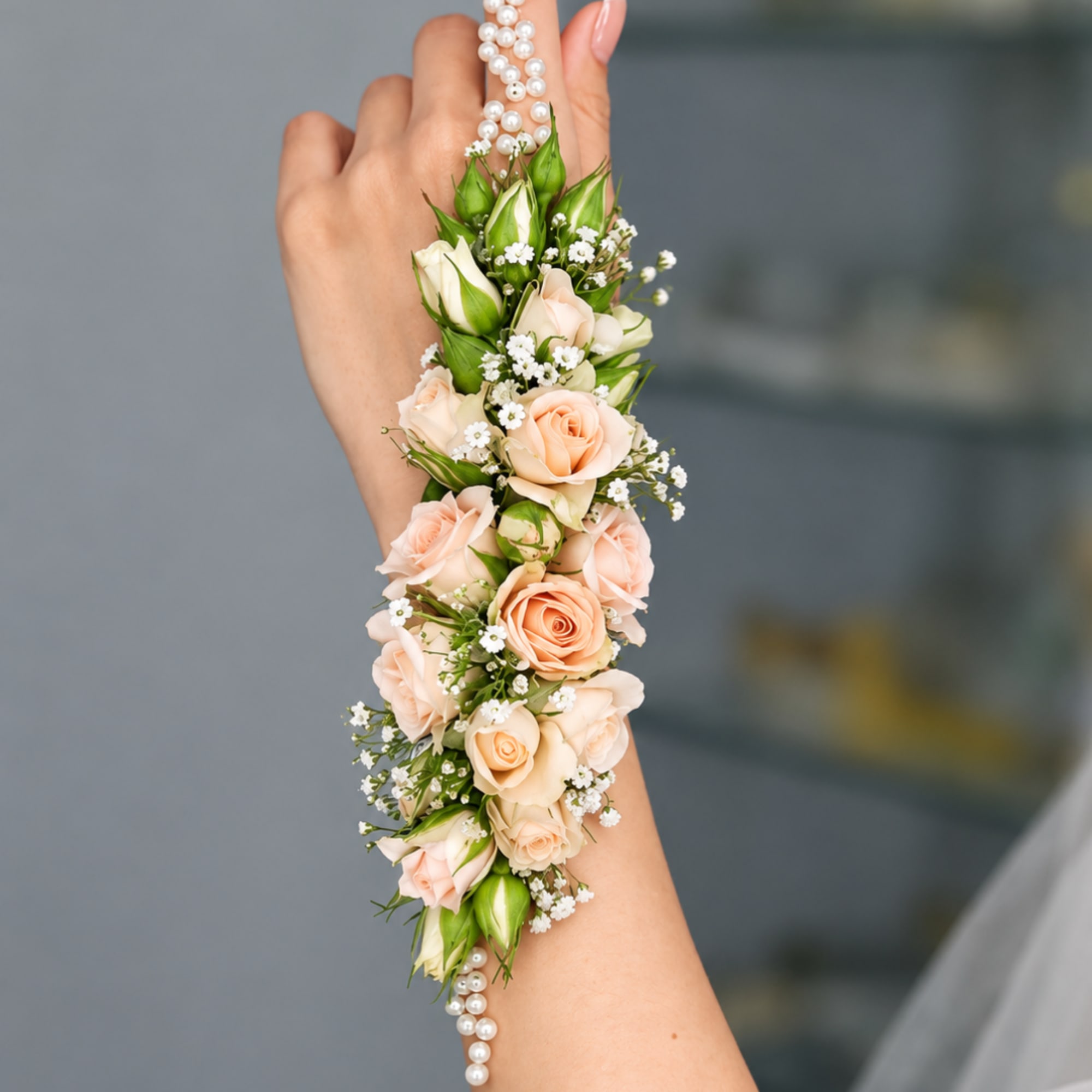 Peach rose wrist corsage with pearl bracelet