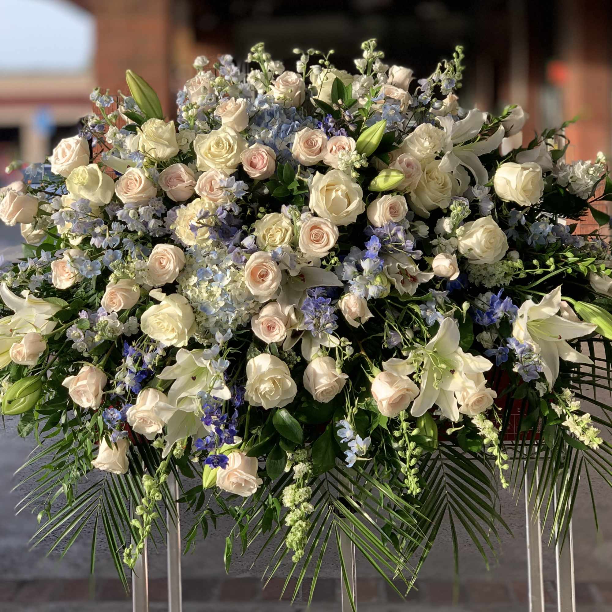 Large white and blush floral spray with lilies and roses
