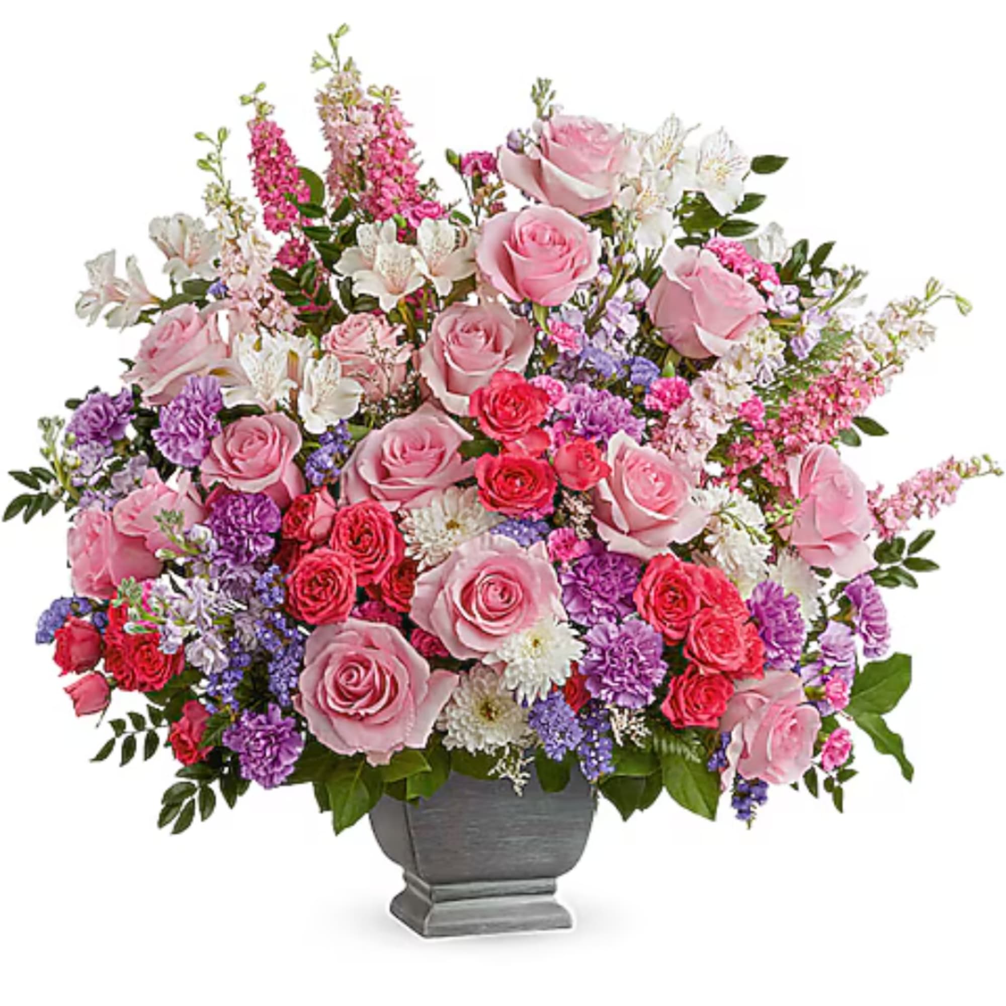 Pink and purple mixed flower arrangement in a gray vase