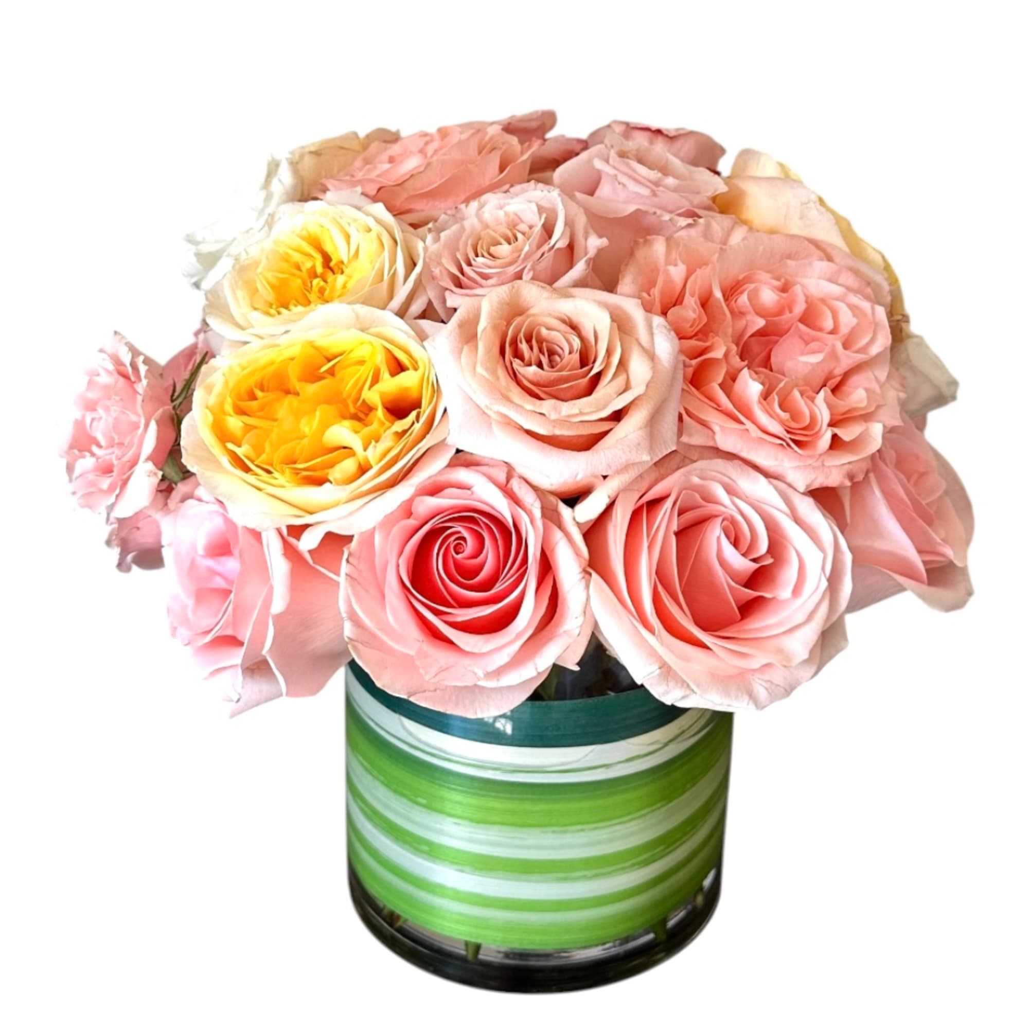 Pink and yellow roses arranged in a striped glass vase, photo 2 of 5