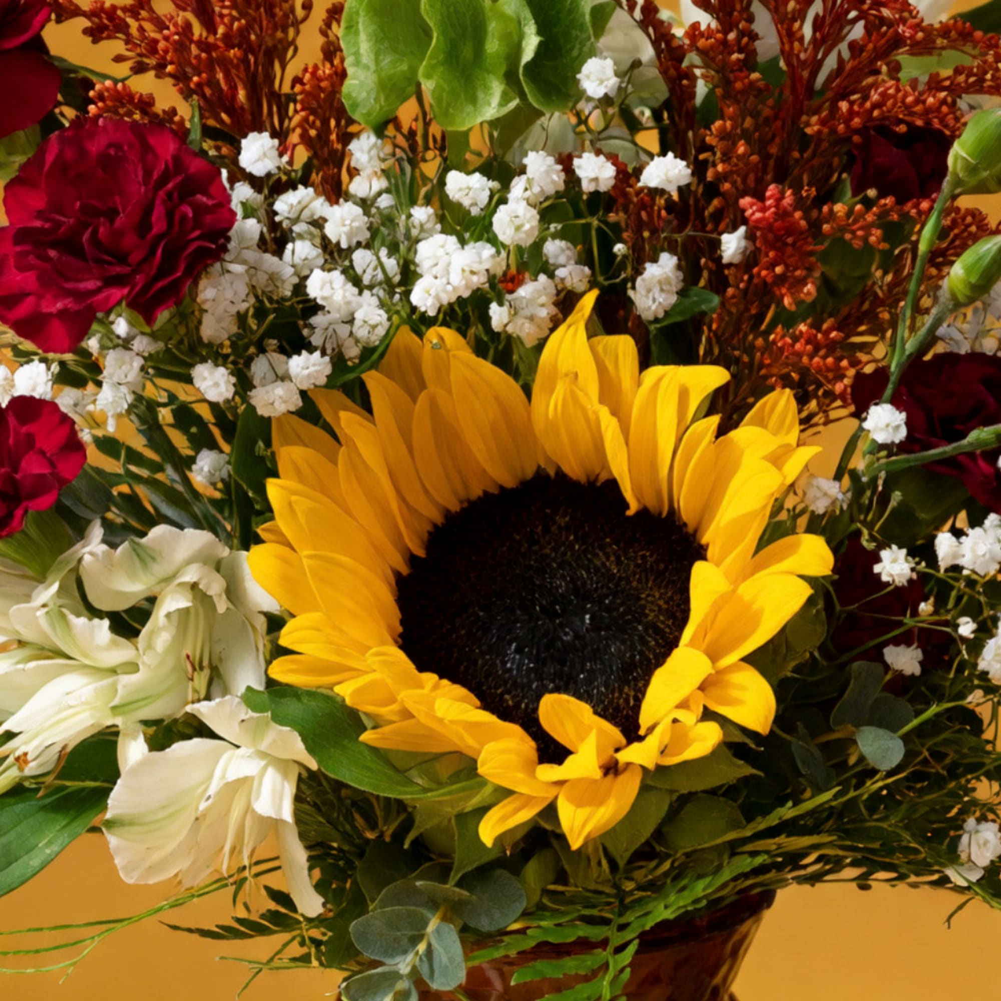 Sunflower bouquet with red carnations and white lilies