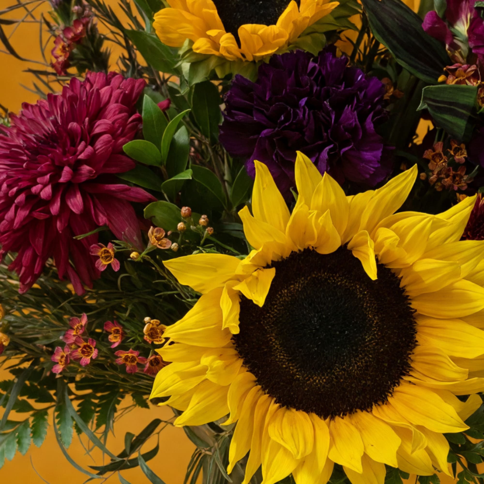 Bouquet with a sunflower, purple chrysanthemum, and pink blooms