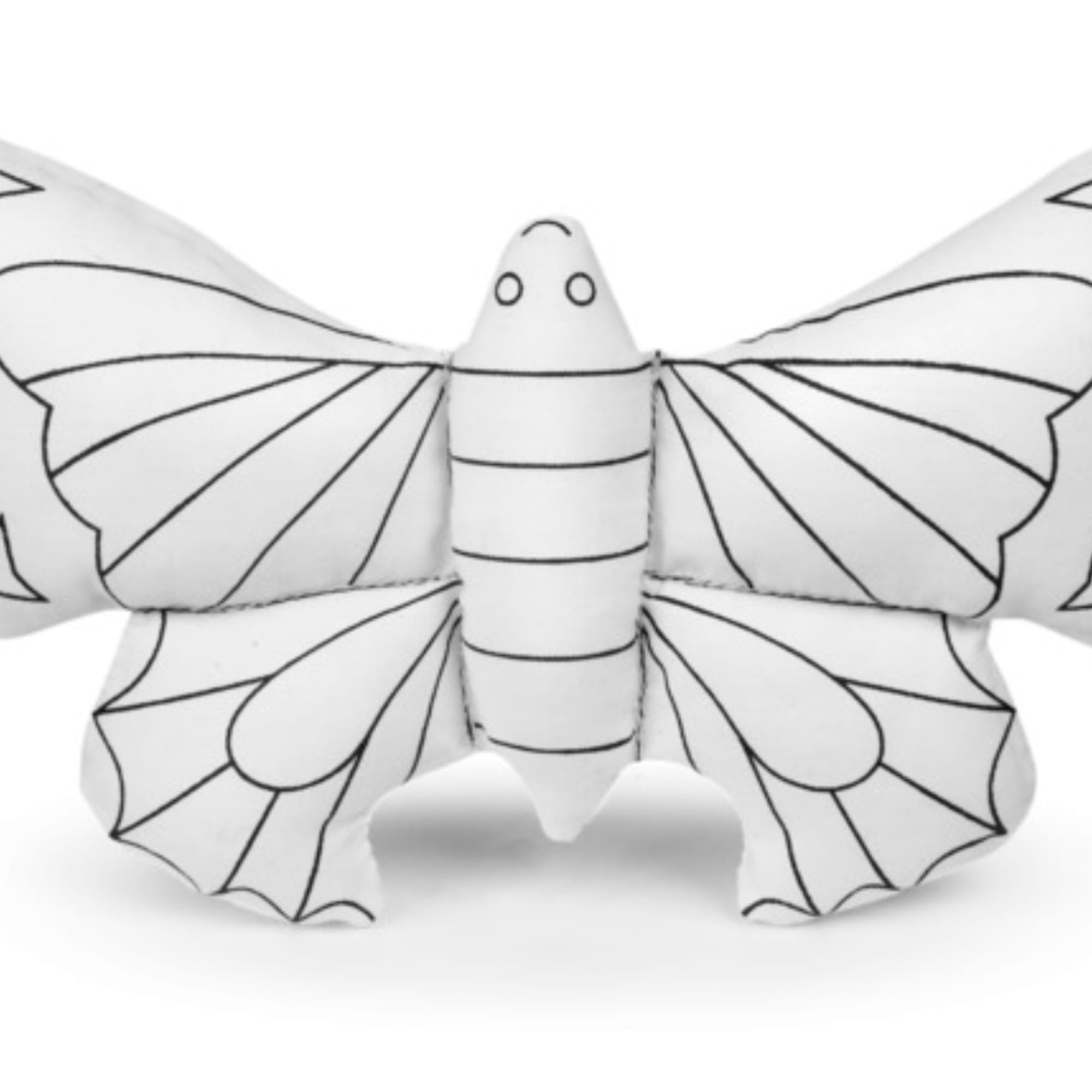 White butterfly-shaped decorative pillow with black outline details