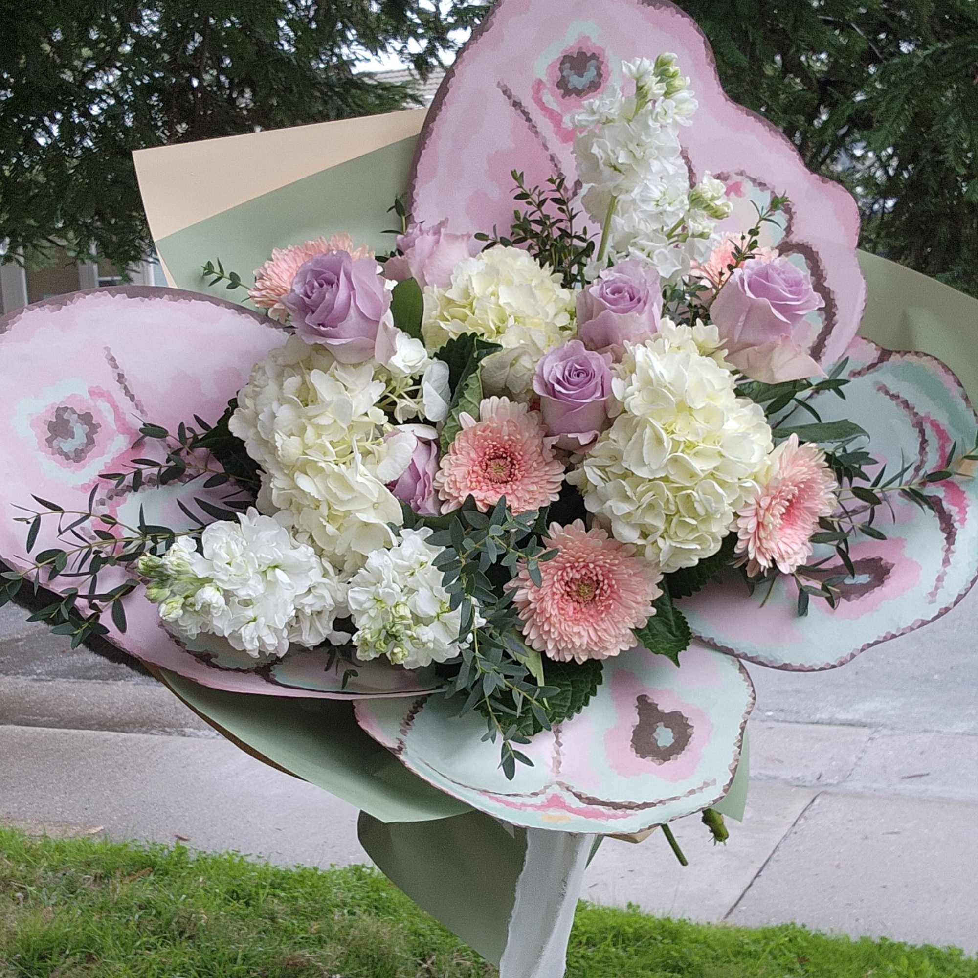 This is very unique arrangement with a beautiful butterfly wings. The flowers