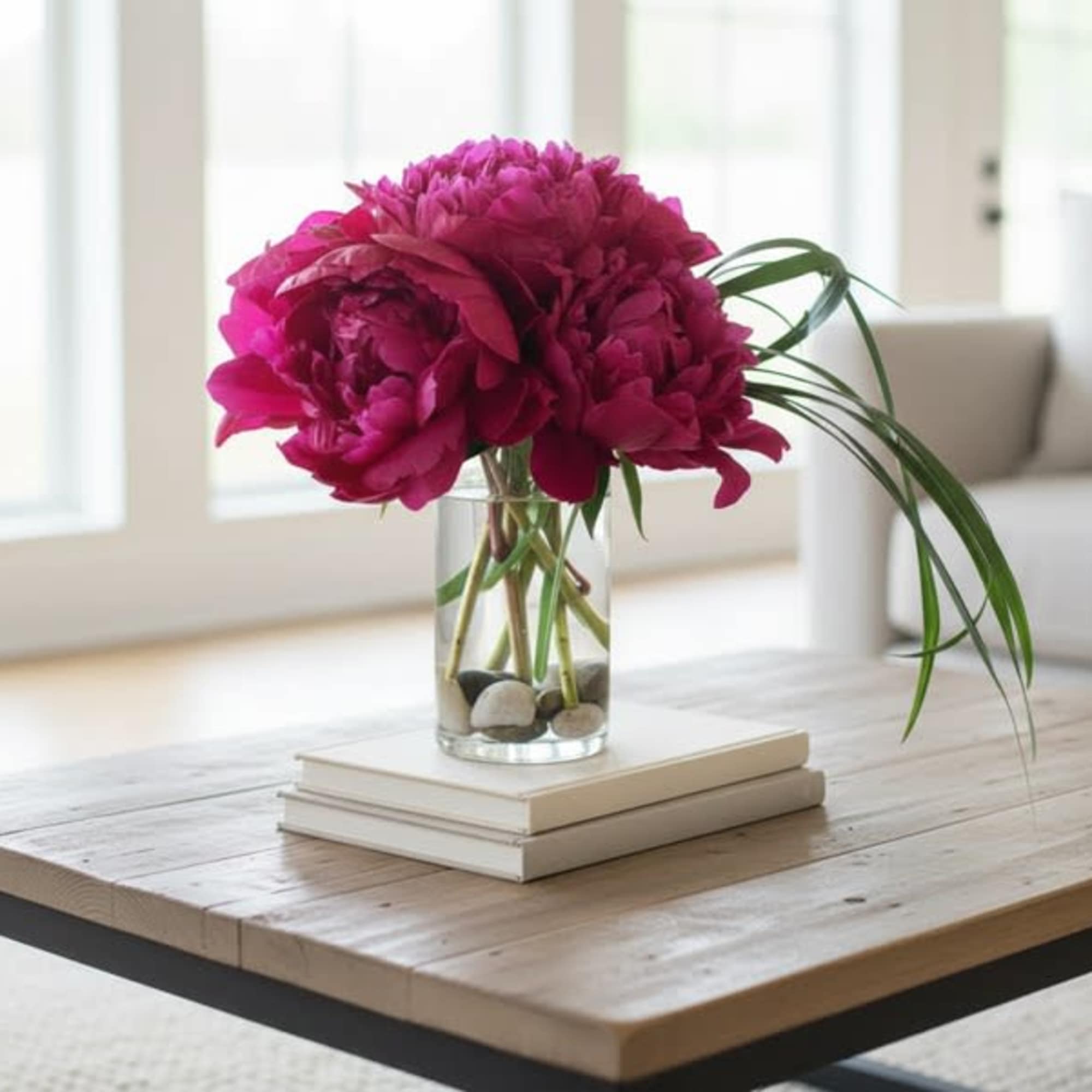 This design features 6 luscious peonies in a vase accented with river