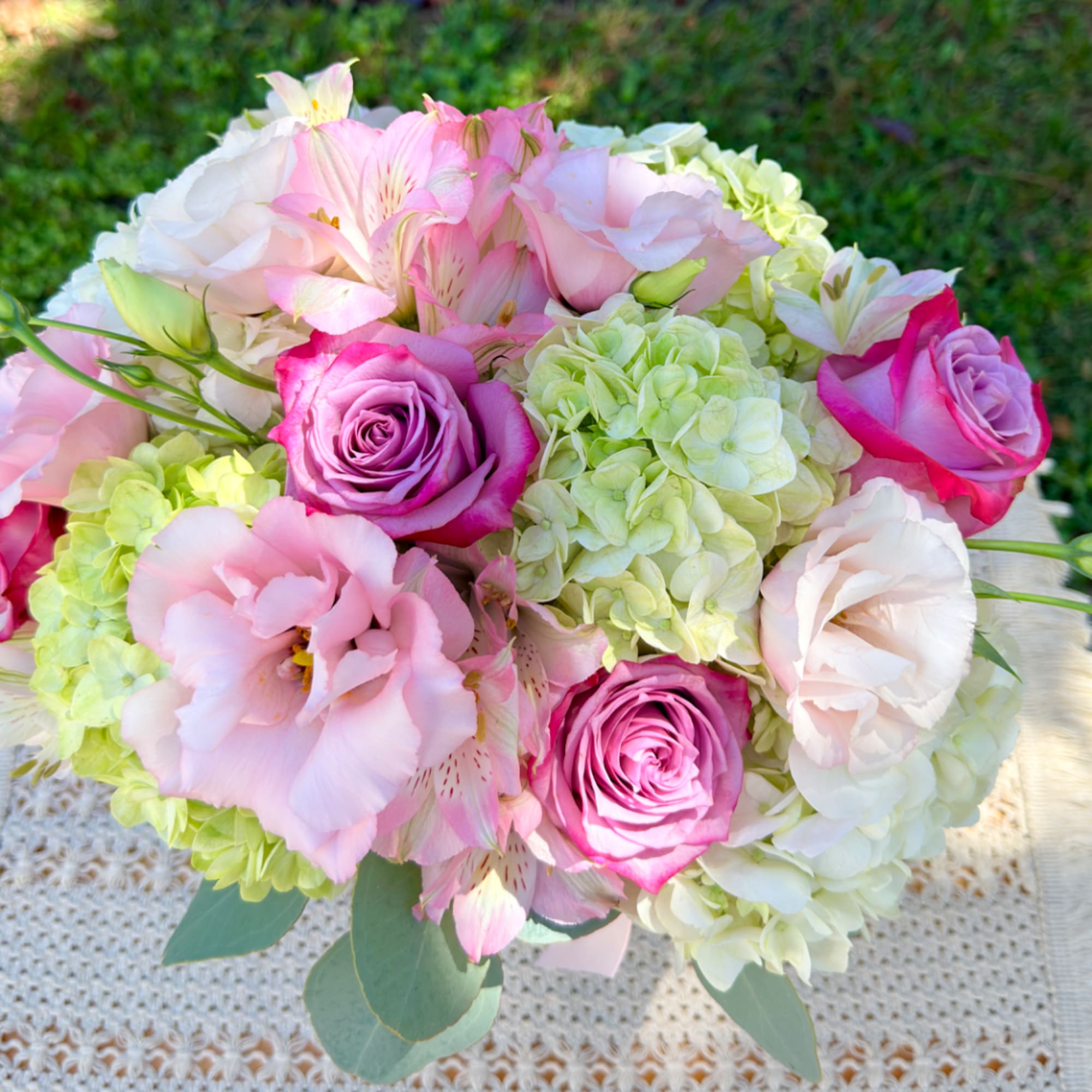 Pink and white bouquet with roses, hydrangeas, and alstroemeria