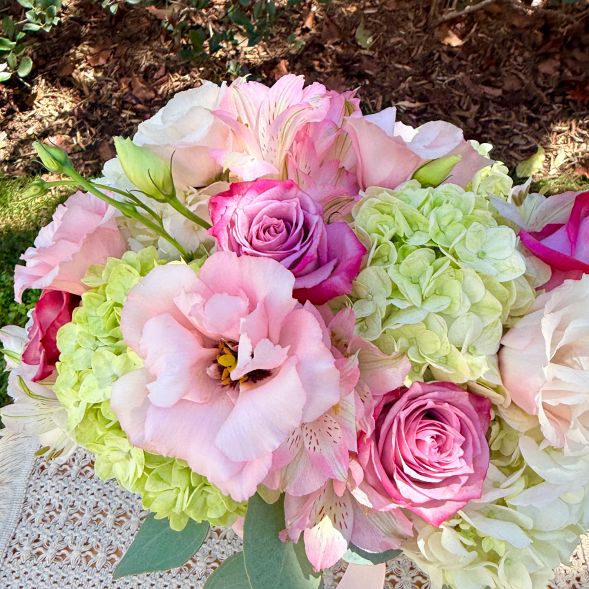 Pink and white bouquet with roses, hydrangeas, and lilies