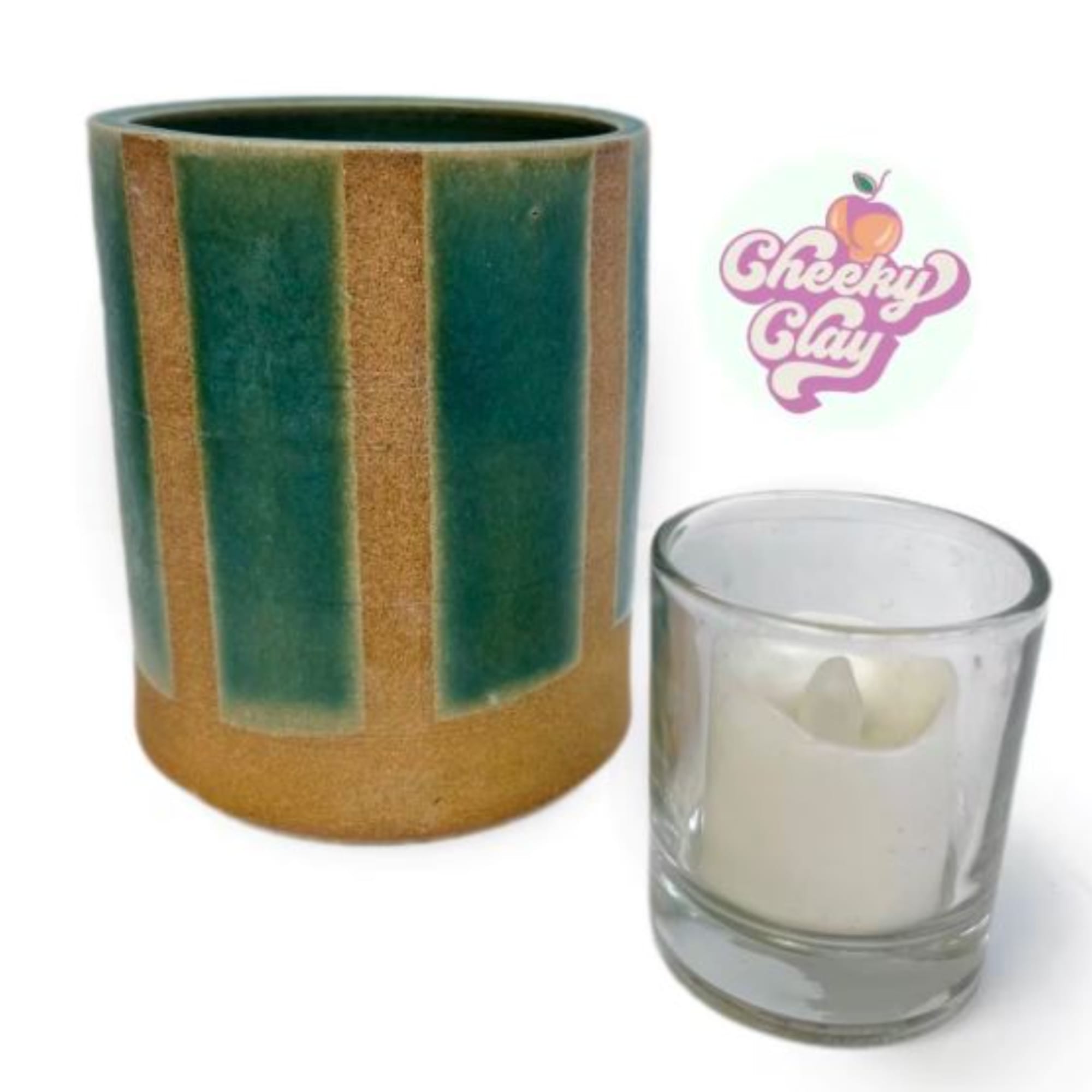 Two candles in glass containers, one green and gold and one clear with white wax