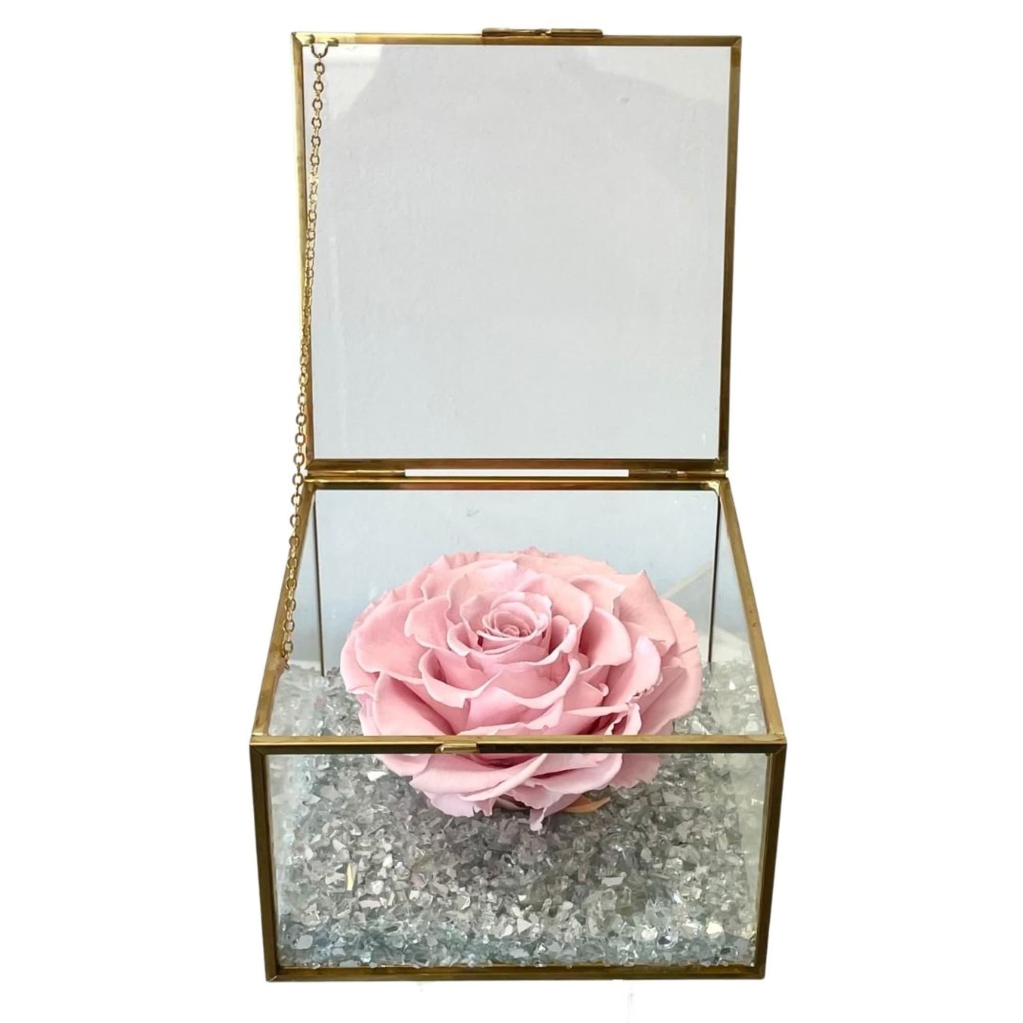 Pink rose in a gold glass box with clear crystals