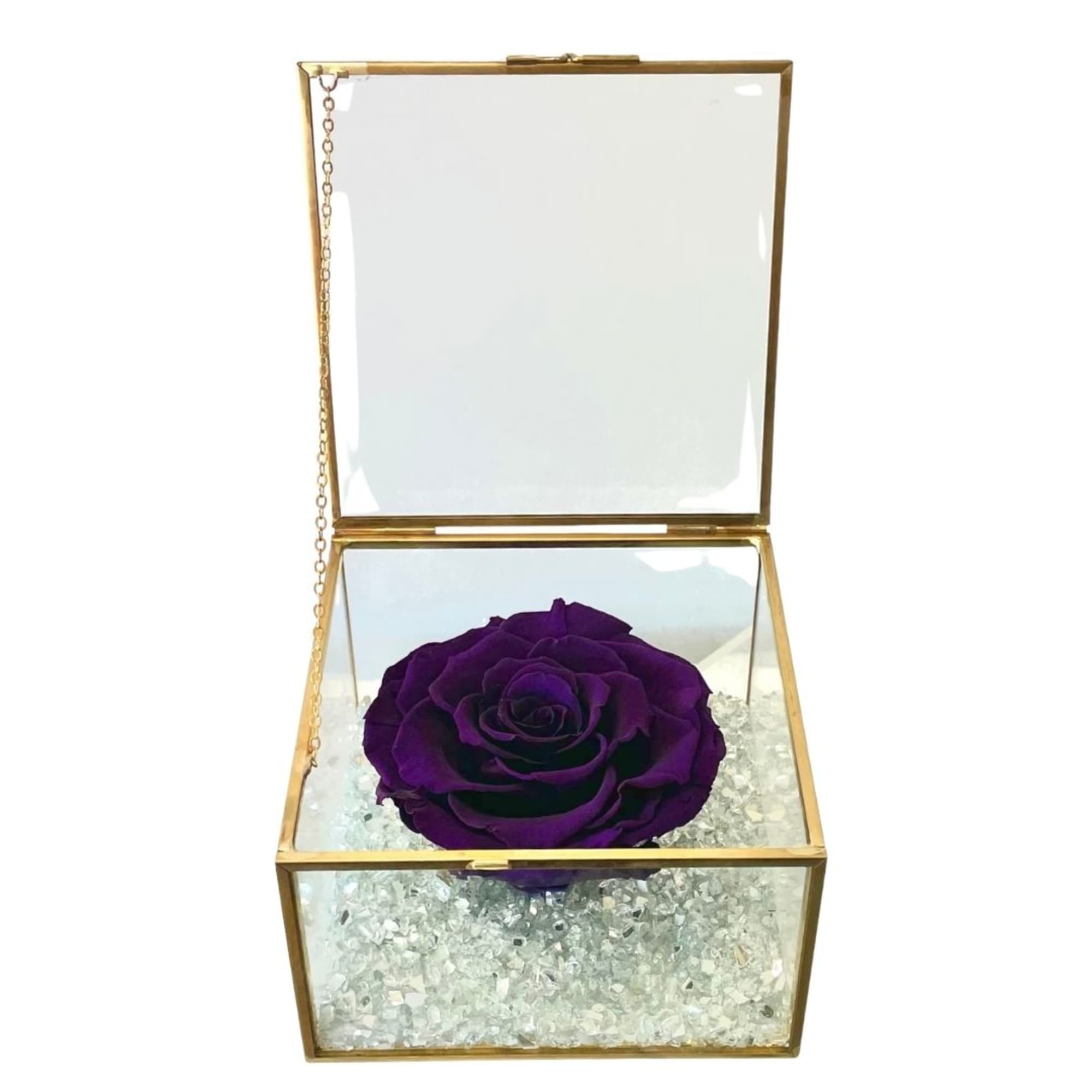 Purple rose in a gold glass keepsake box with clear filler