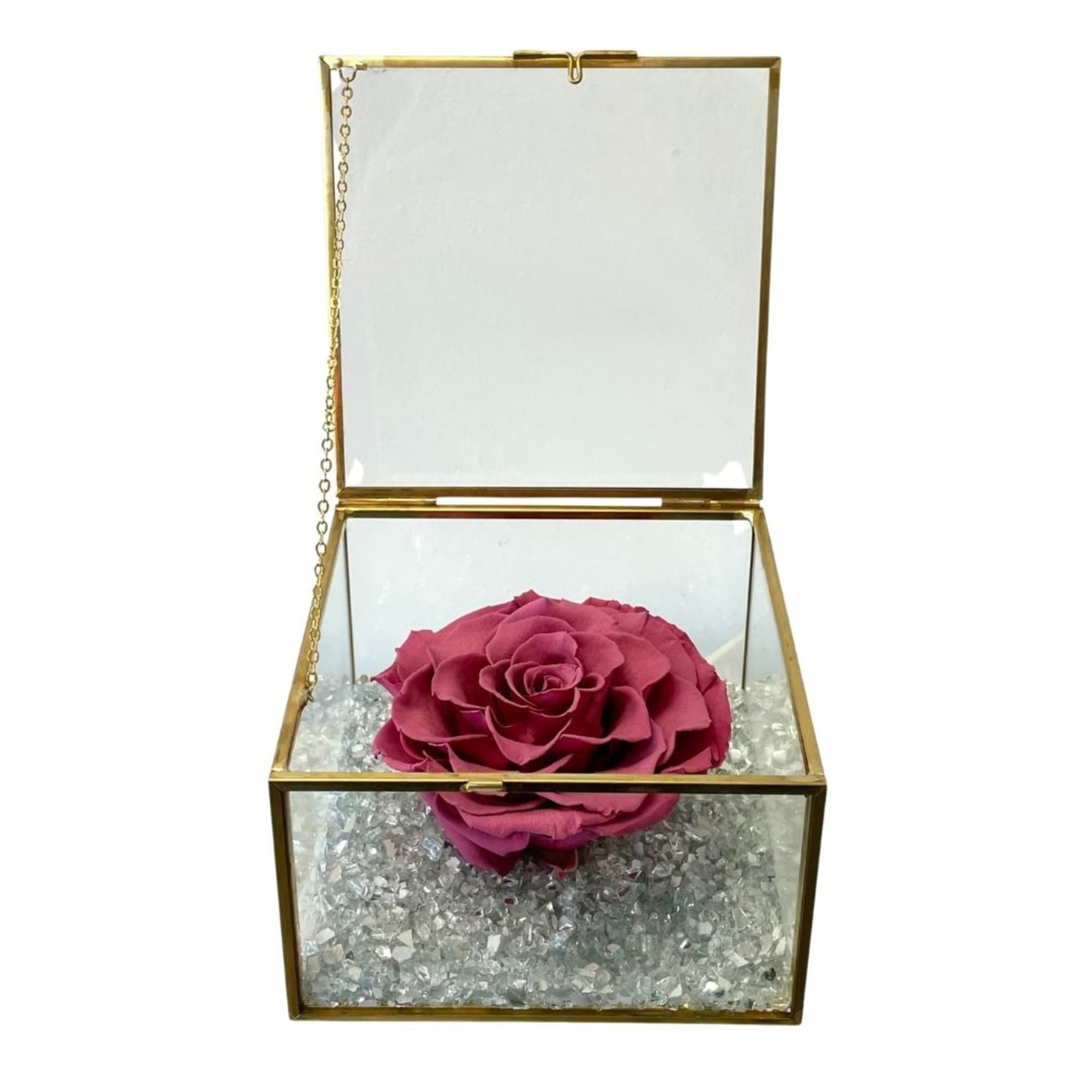 Single pink rose in a glass keepsake box with gold trim