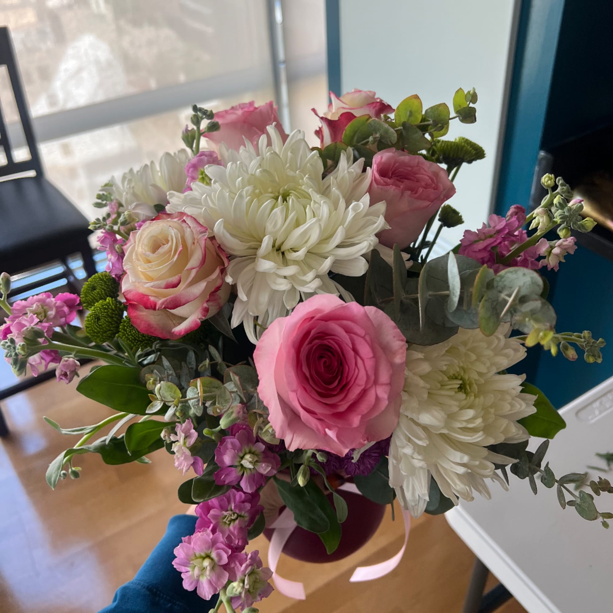 Pink and white bouquet with roses and chrysanthemums in a vase