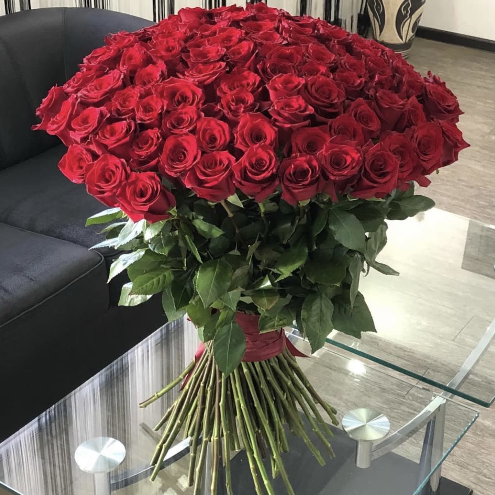 Large bouquet of red roses with long stems