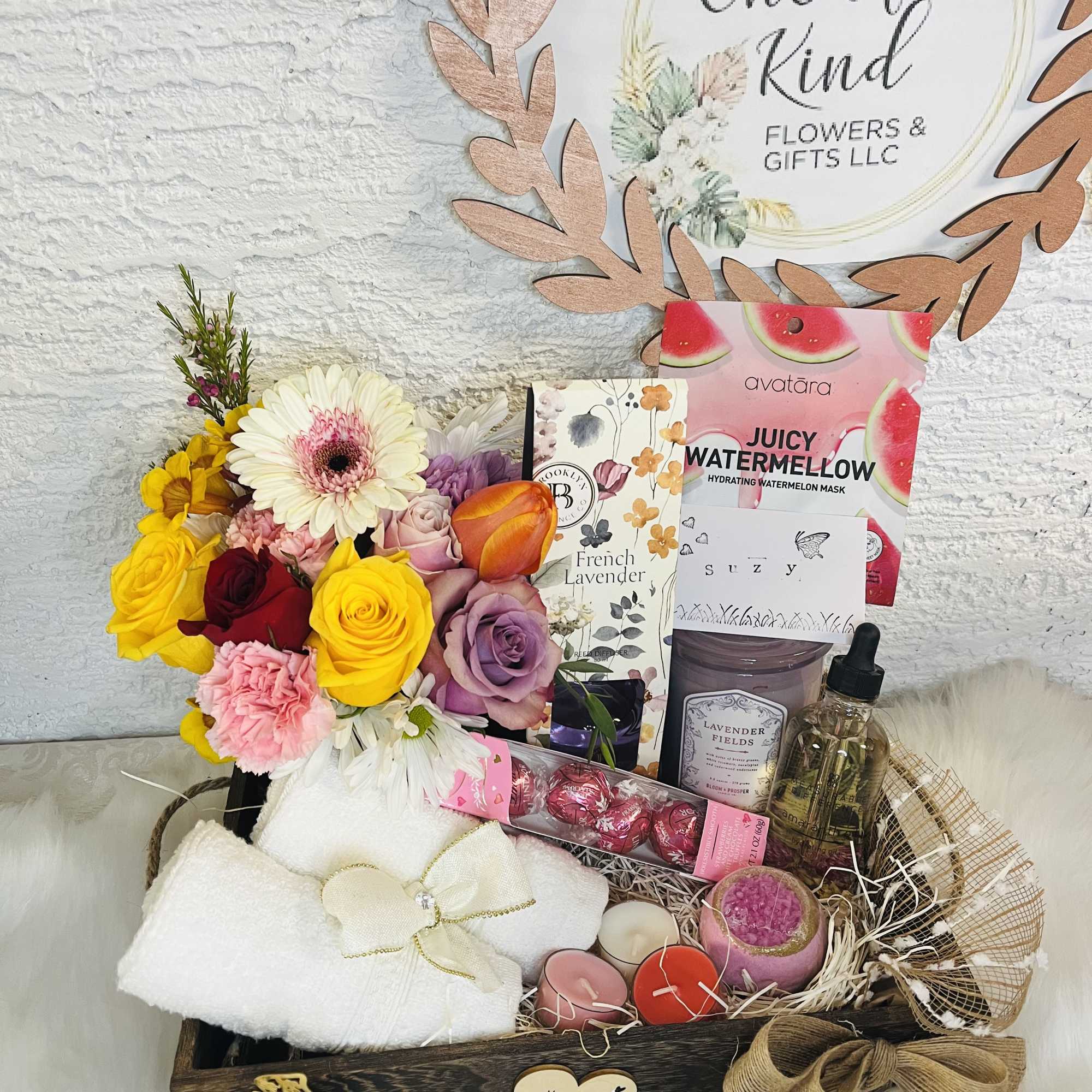 Gift basket with mixed flowers, candles, chocolates, and bath items, photo 3 of 4