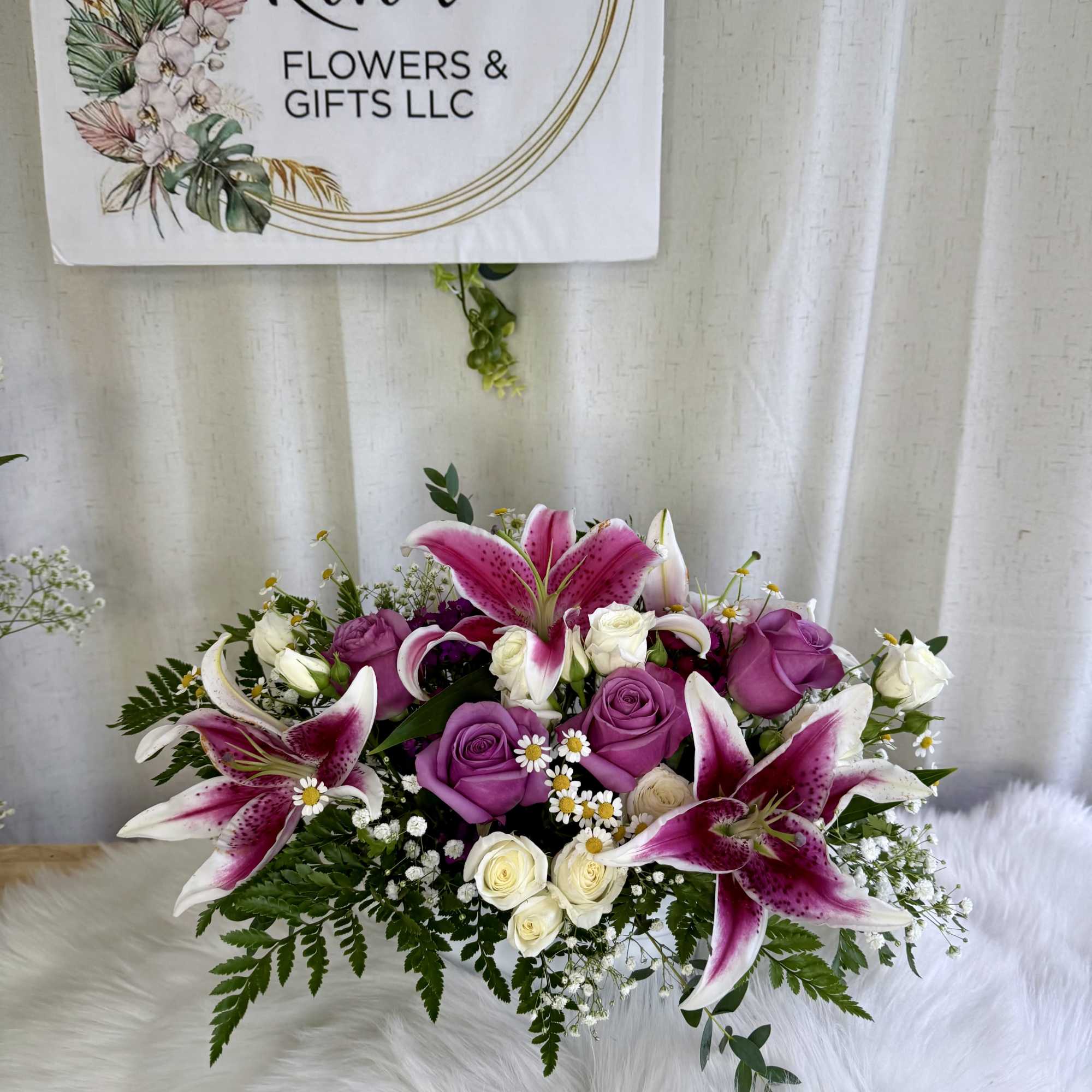 Bouquet of pink lilies and purple and white roses
