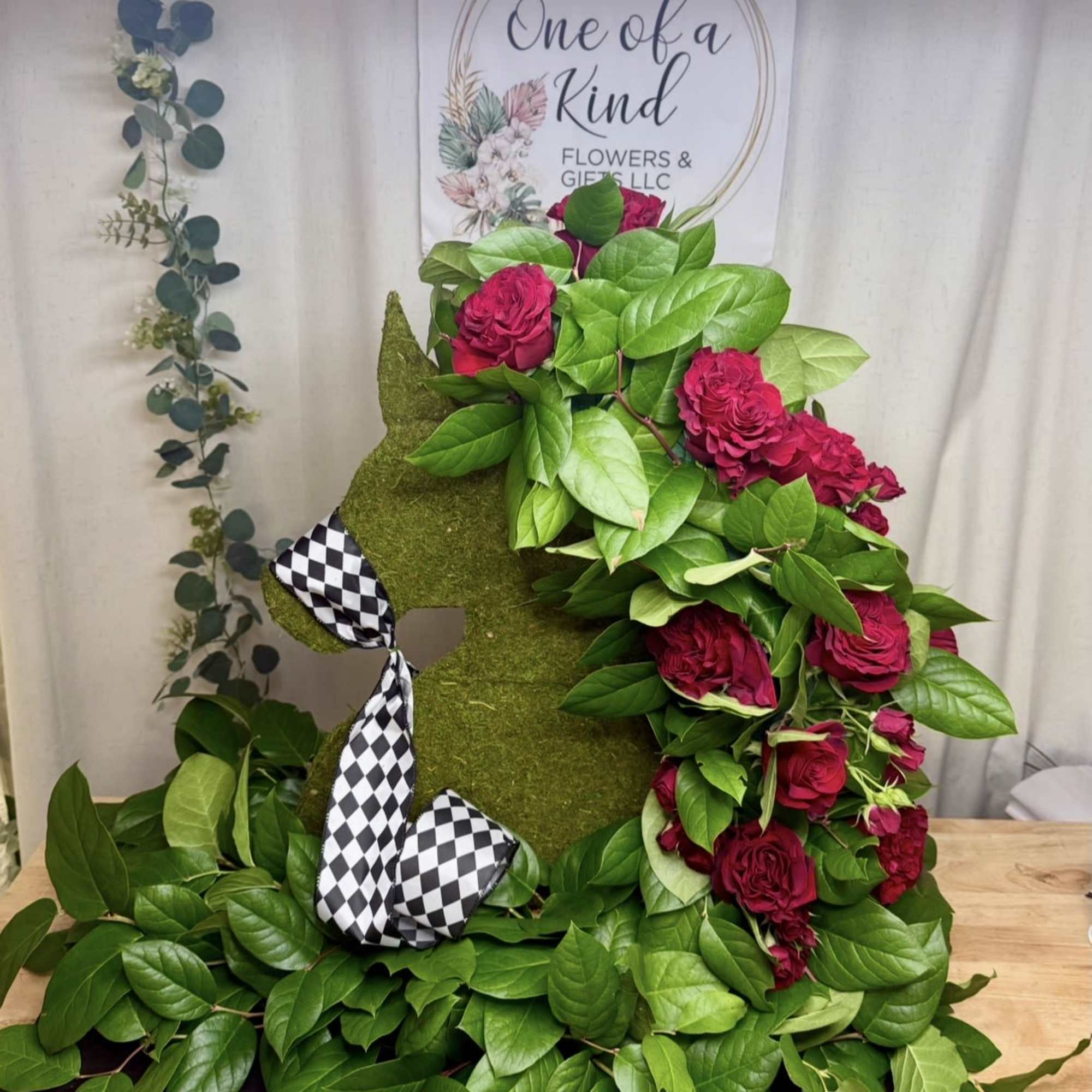 A unique and elegant horse-shaped floral design, created to honor a loved