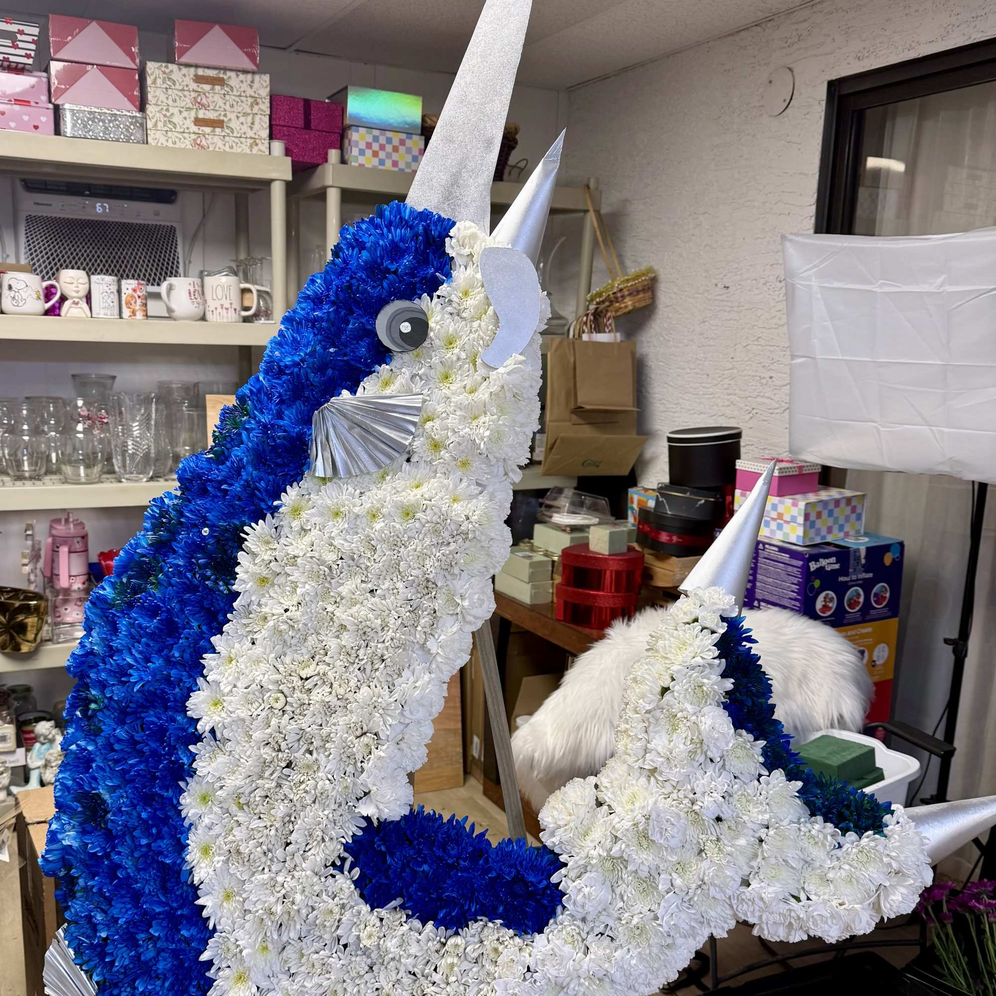 A striking and artistic ocean-inspired floral tribute, designed to honor a loved, photo 3 of 3