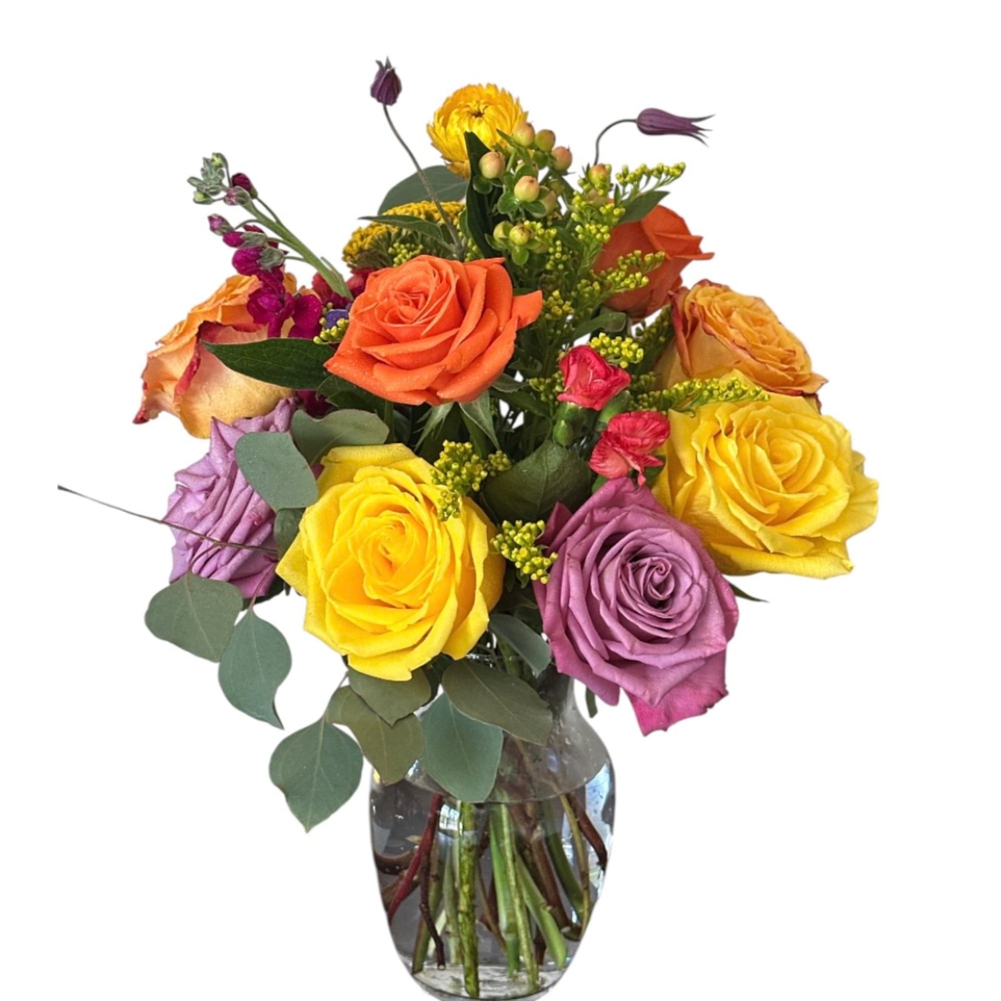 Colorful rose bouquet in a clear glass vase