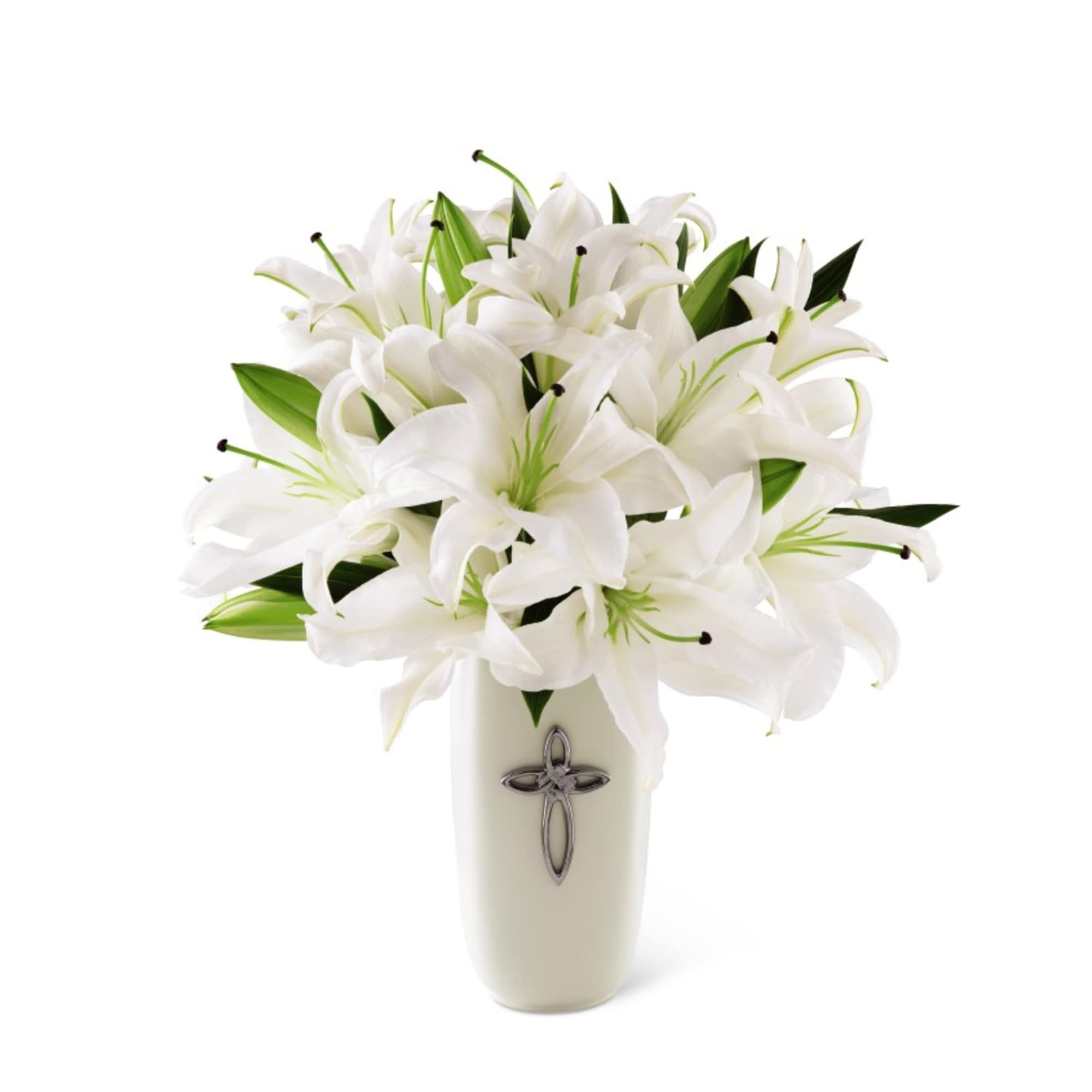 White lilies arranged in a cream vase with a cross emblem