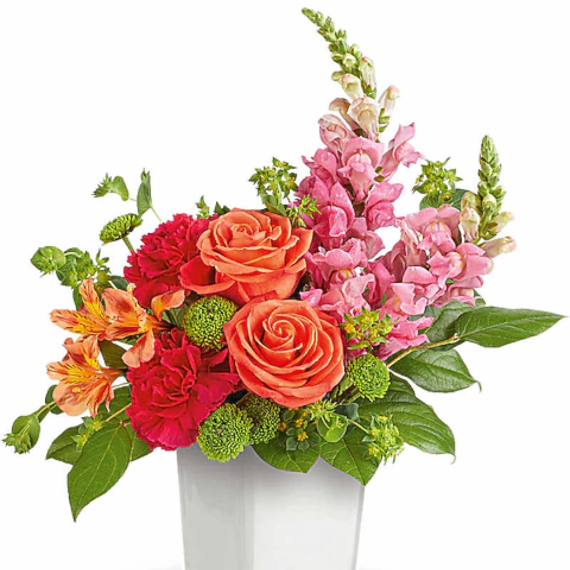 Mixed bouquet of orange roses, pink snapdragons, and red carnations in a white vase