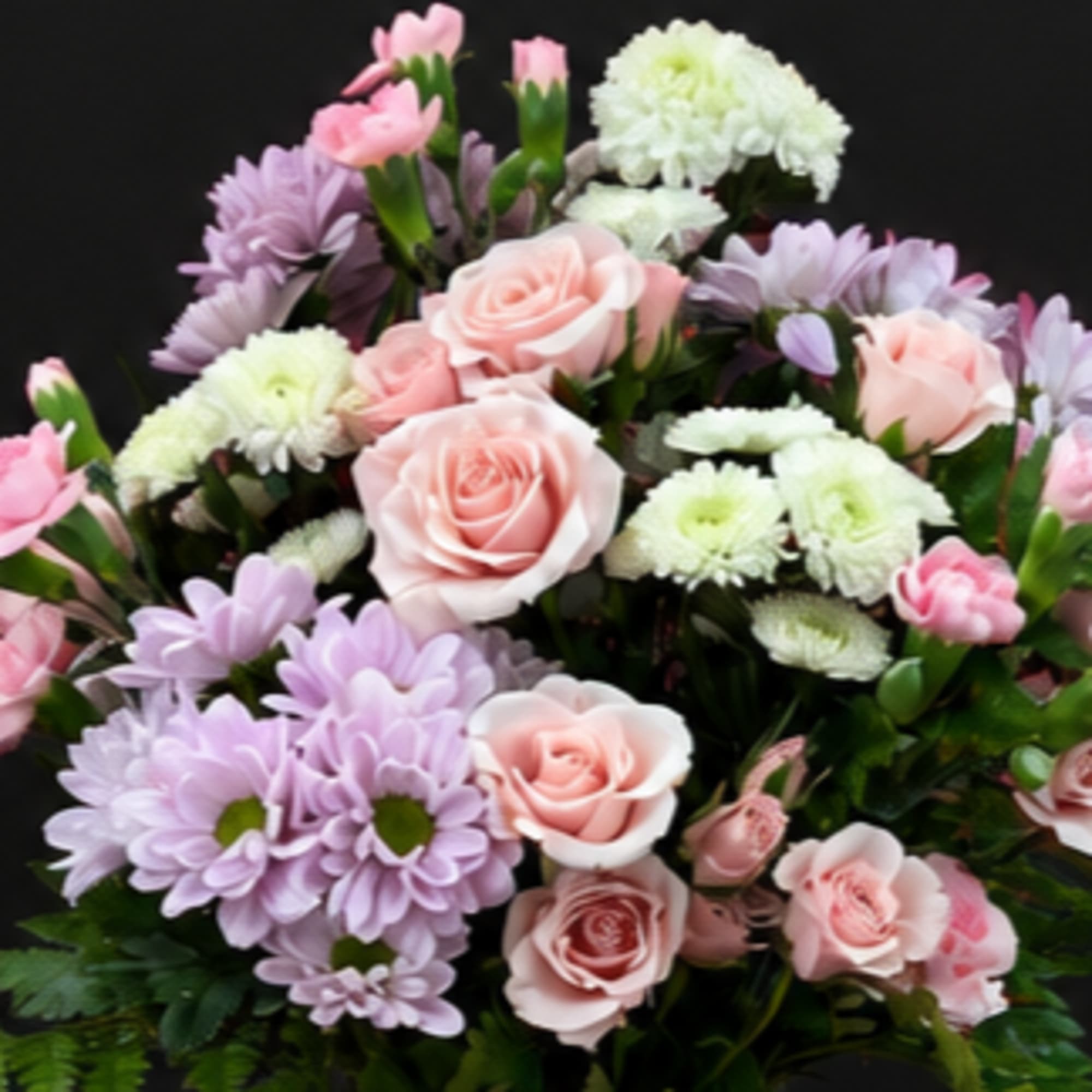 Pink roses and lavender daisies arranged in a bouquet