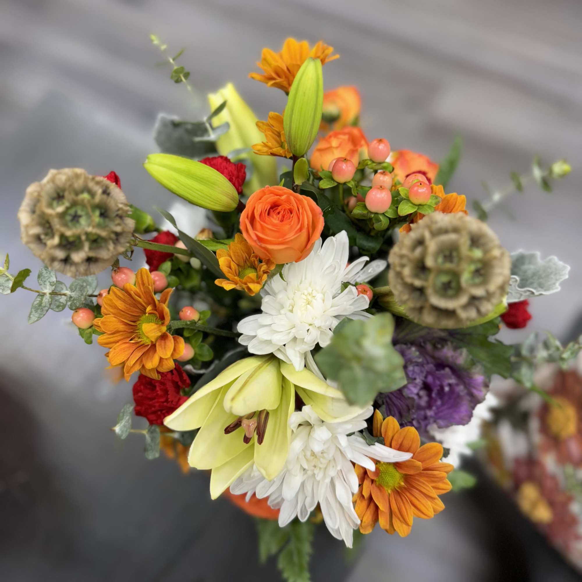 &ldquo;A unique arrangement set in a natural pumpkin, featuring vibrant, handpicked flowers, photo 2 of 2