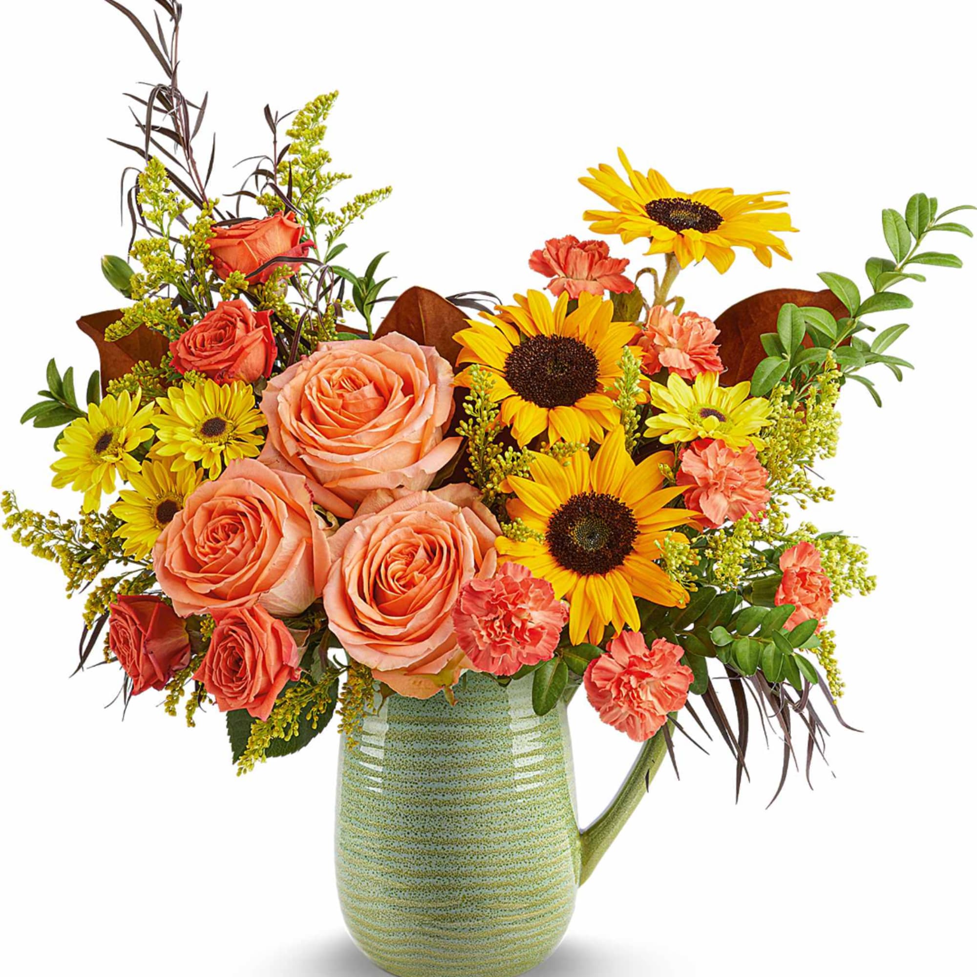Bouquet of peach roses, sunflowers, and coral carnations in a green ceramic pitcher