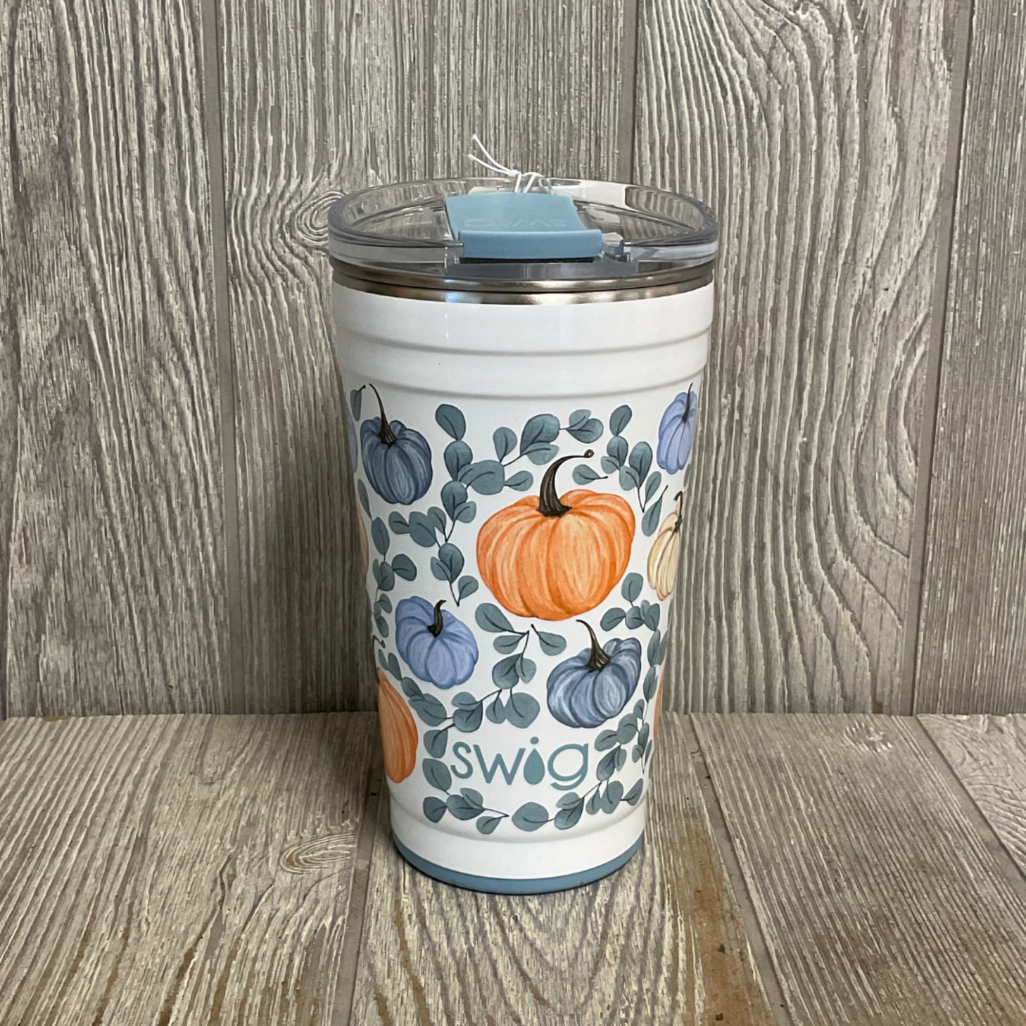 Pumpkin-patterned insulated tumbler with a clear lid