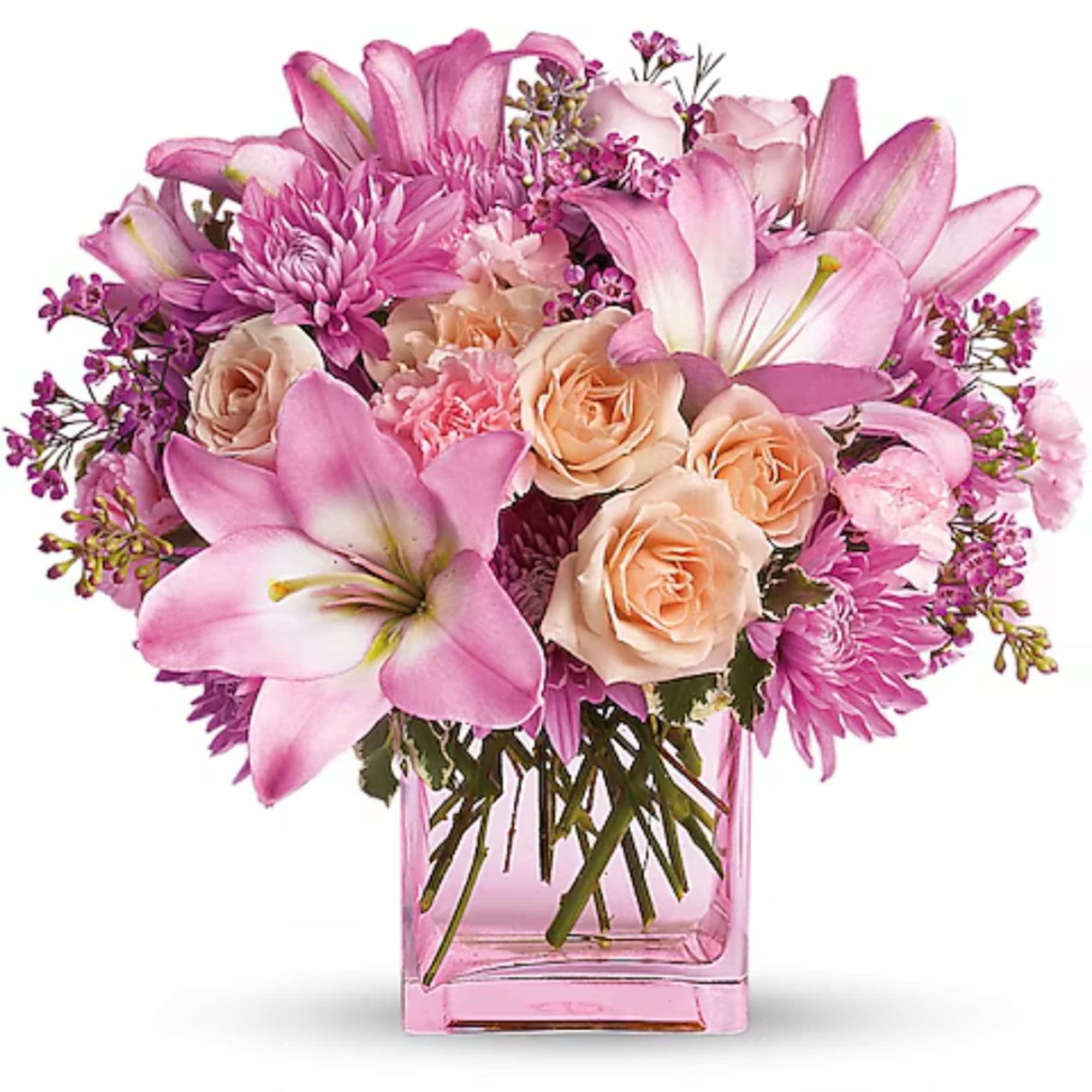 Pink lilies, roses, and chrysanthemums in a pink glass vase