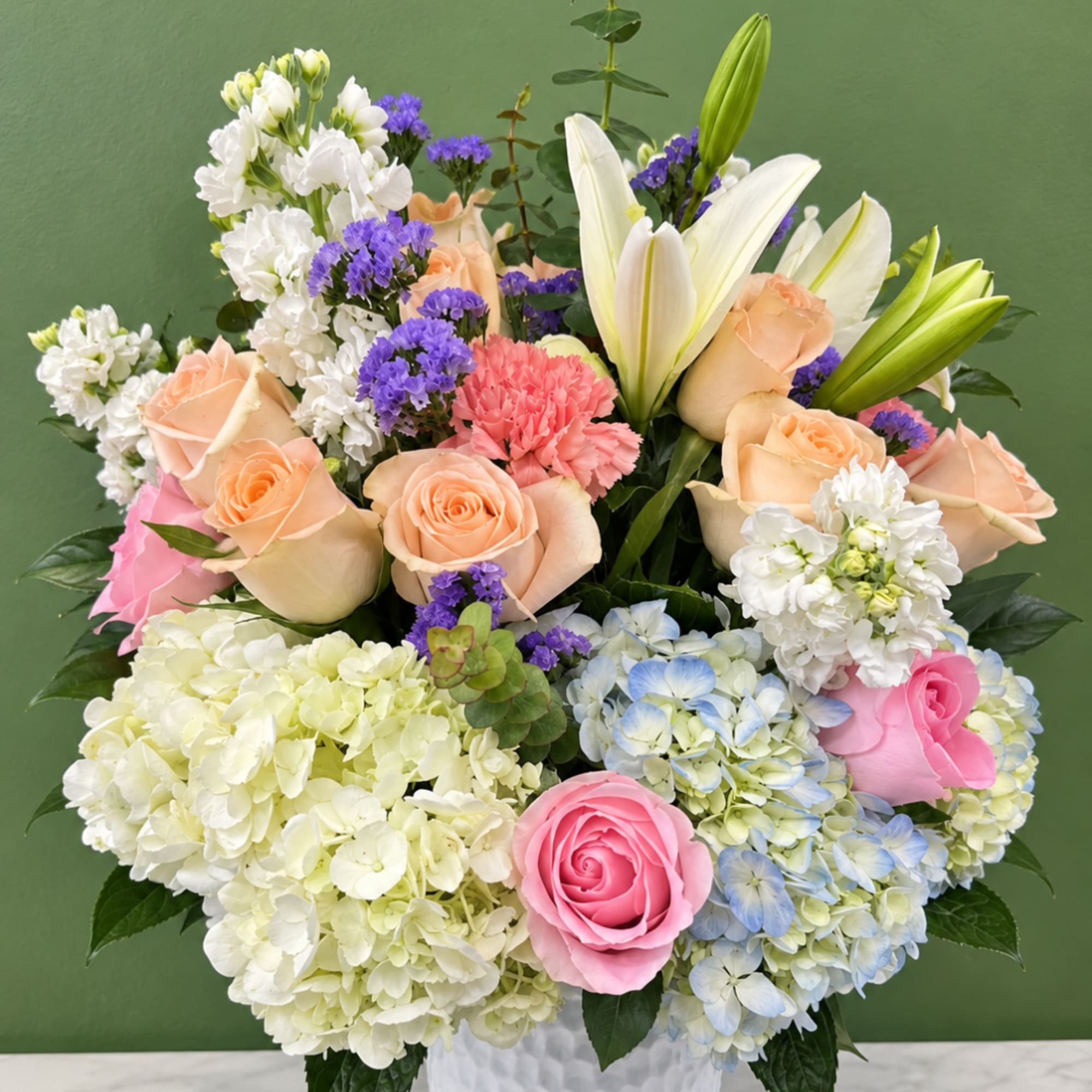 Mixed bouquet with roses, lilies, hydrangeas, and carnations
