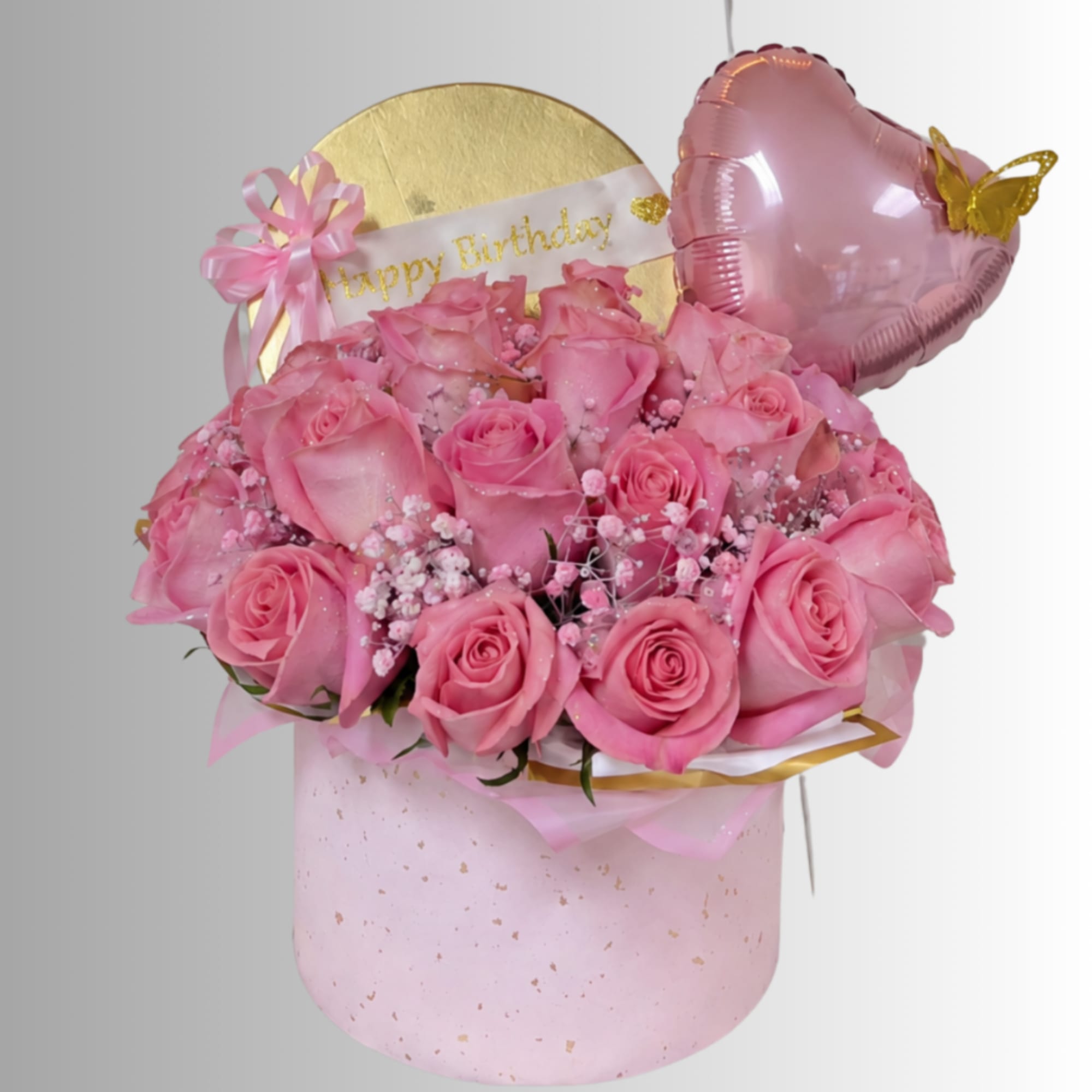 Pink rose bouquet in a round box with a birthday balloon
