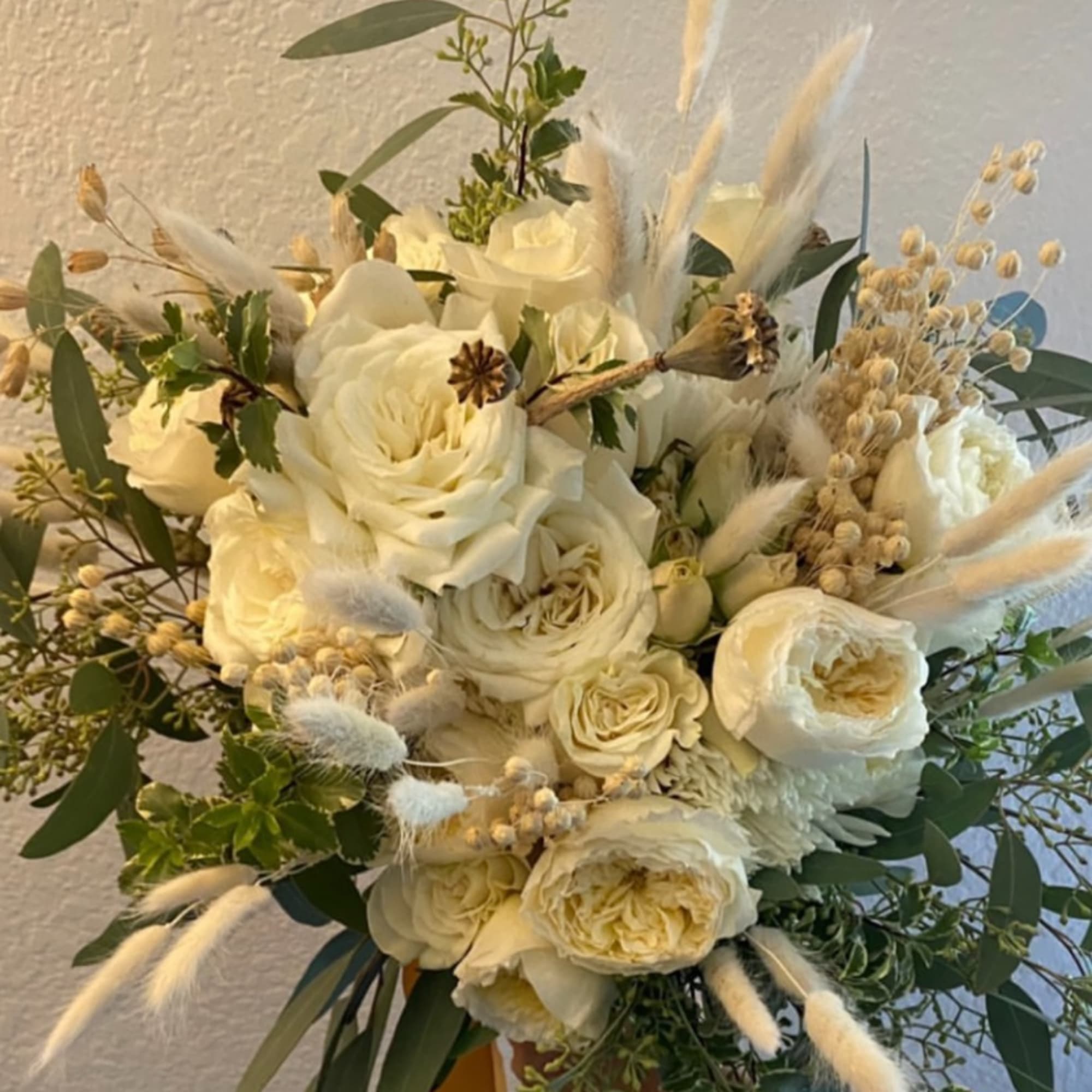 Cream rose bouquet with dried grasses and eucalyptus, photo 2 of 2