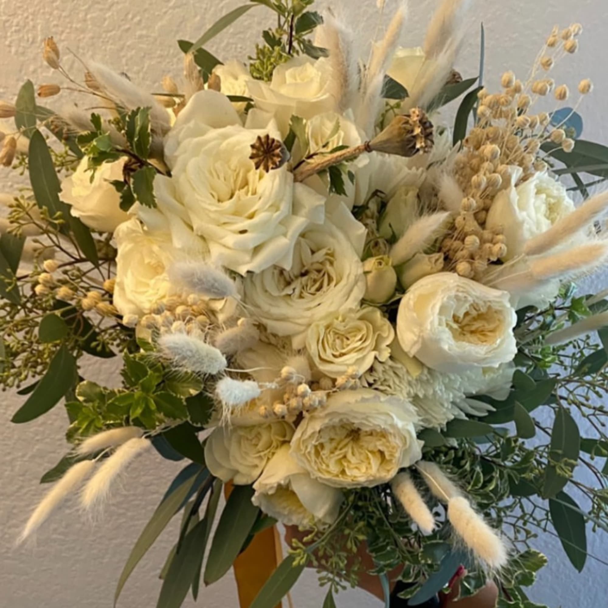 Cream rose bouquet with dried grasses and eucalyptus