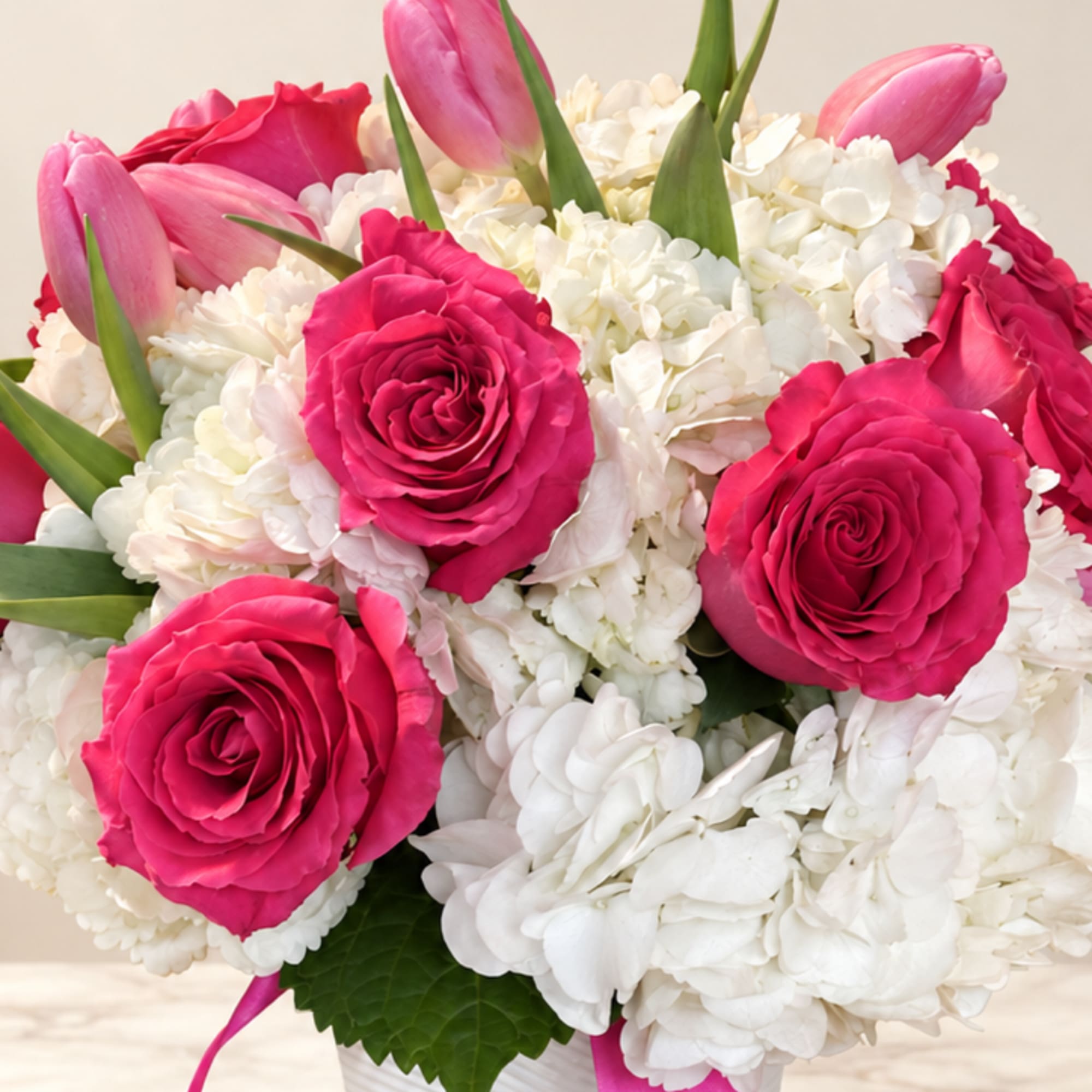 Pink roses and tulips in a white vase with white hydrangeas, photo 2 of 2