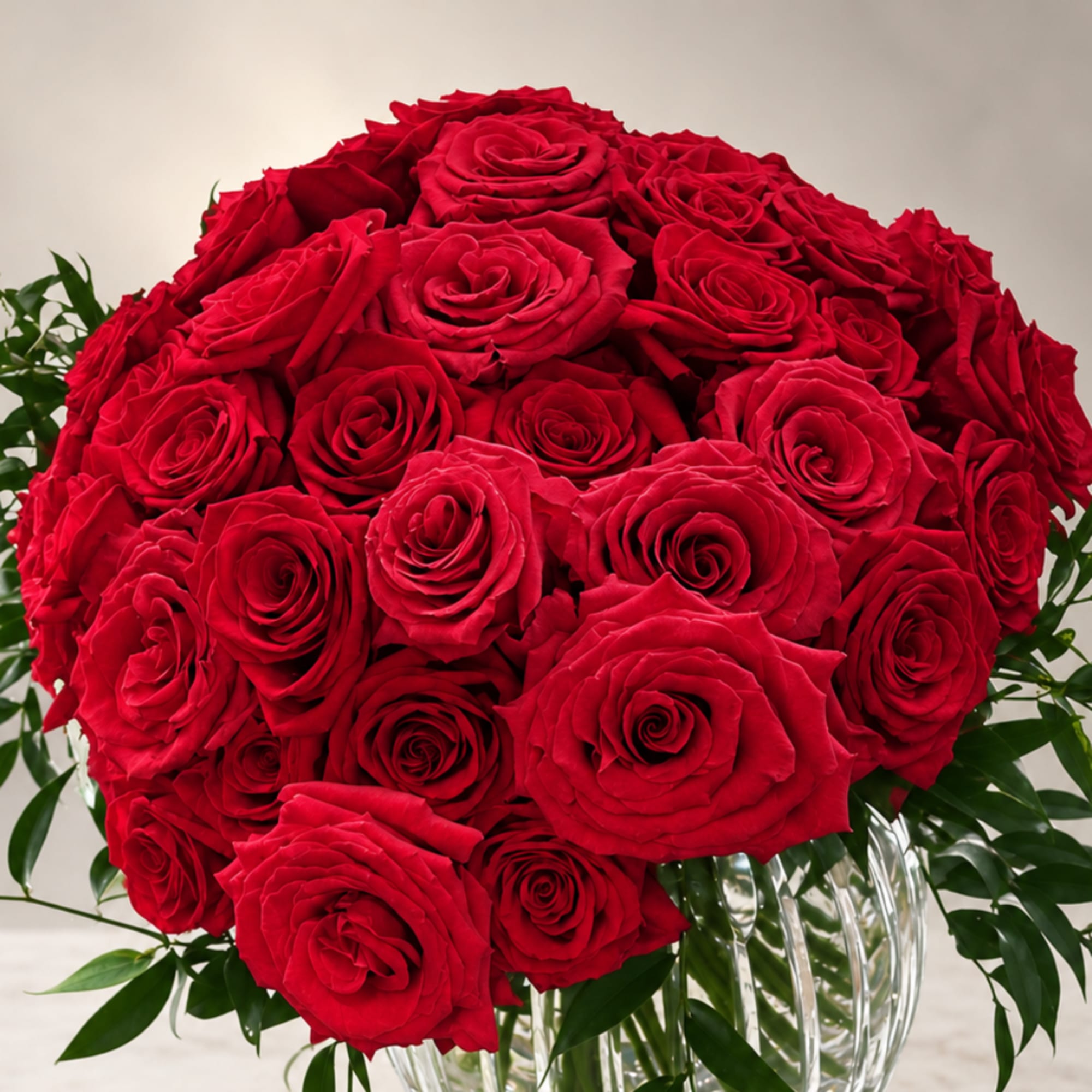 Red rose bouquet in a clear glass vase