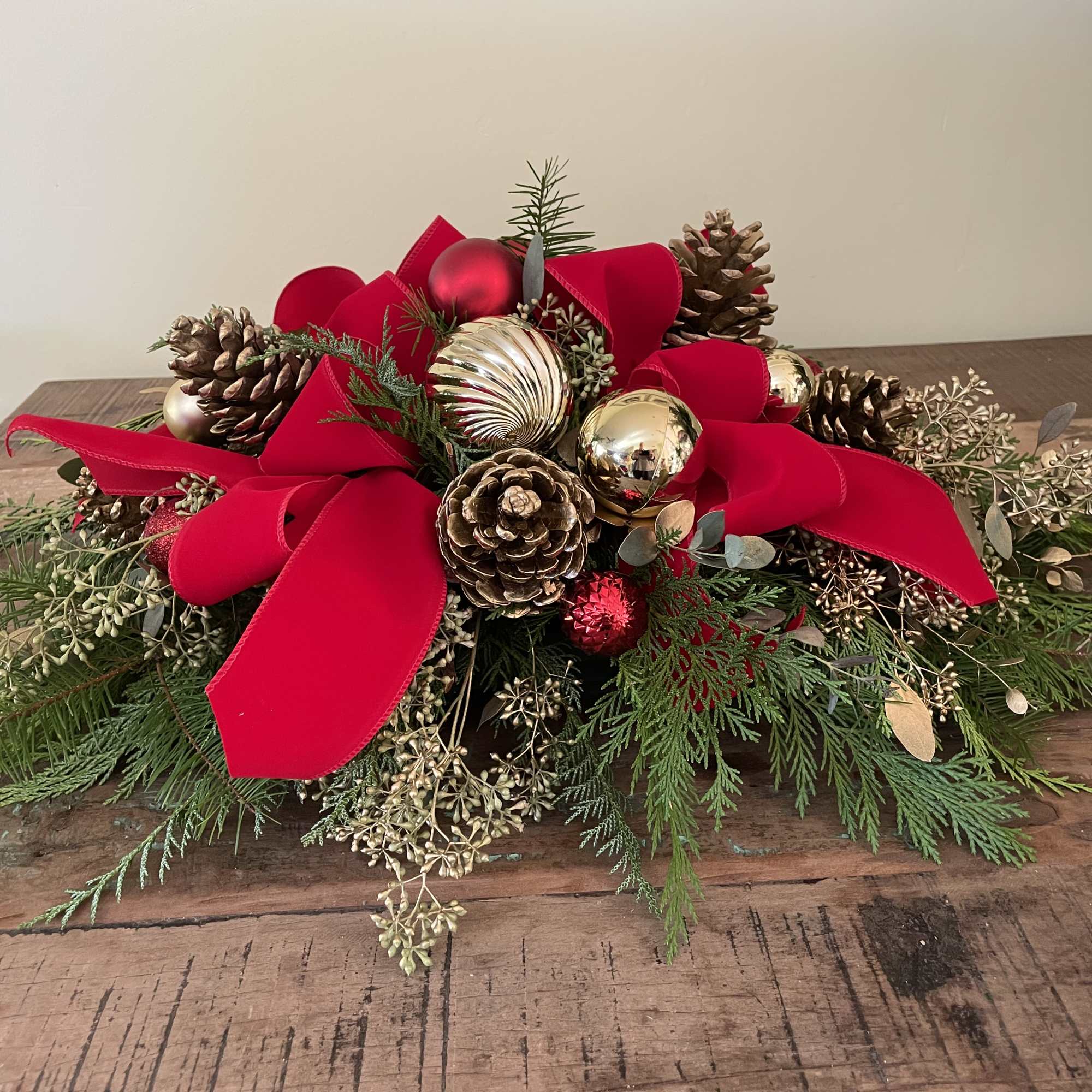 Red and gold ornaments with ribbon and bows
