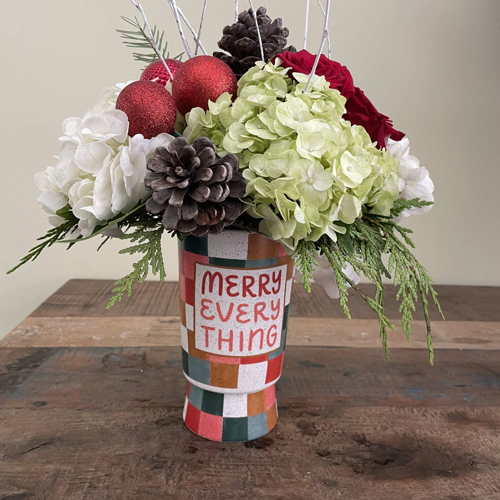 White and green hydrangea, roses berries and cones