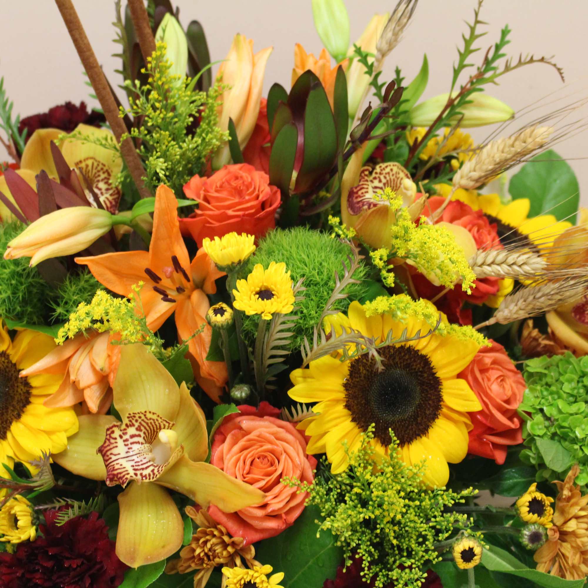 this wooden box is filled to the brim with an autumn arrangement., photo 2 of 4