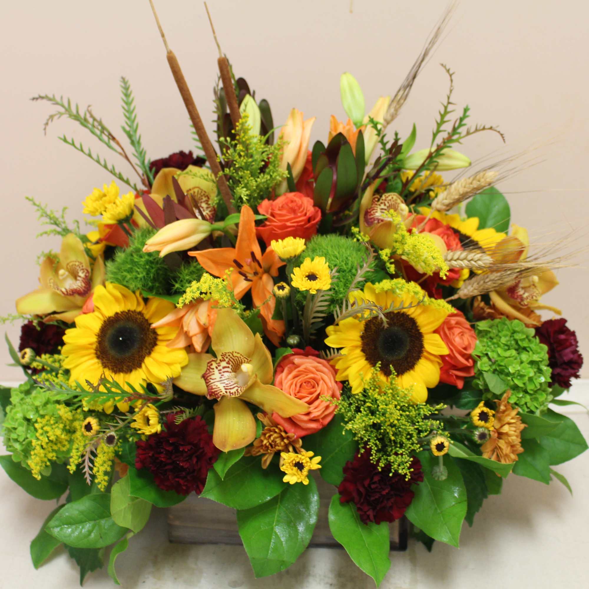 this wooden box is filled to the brim with an autumn arrangement., photo 3 of 4