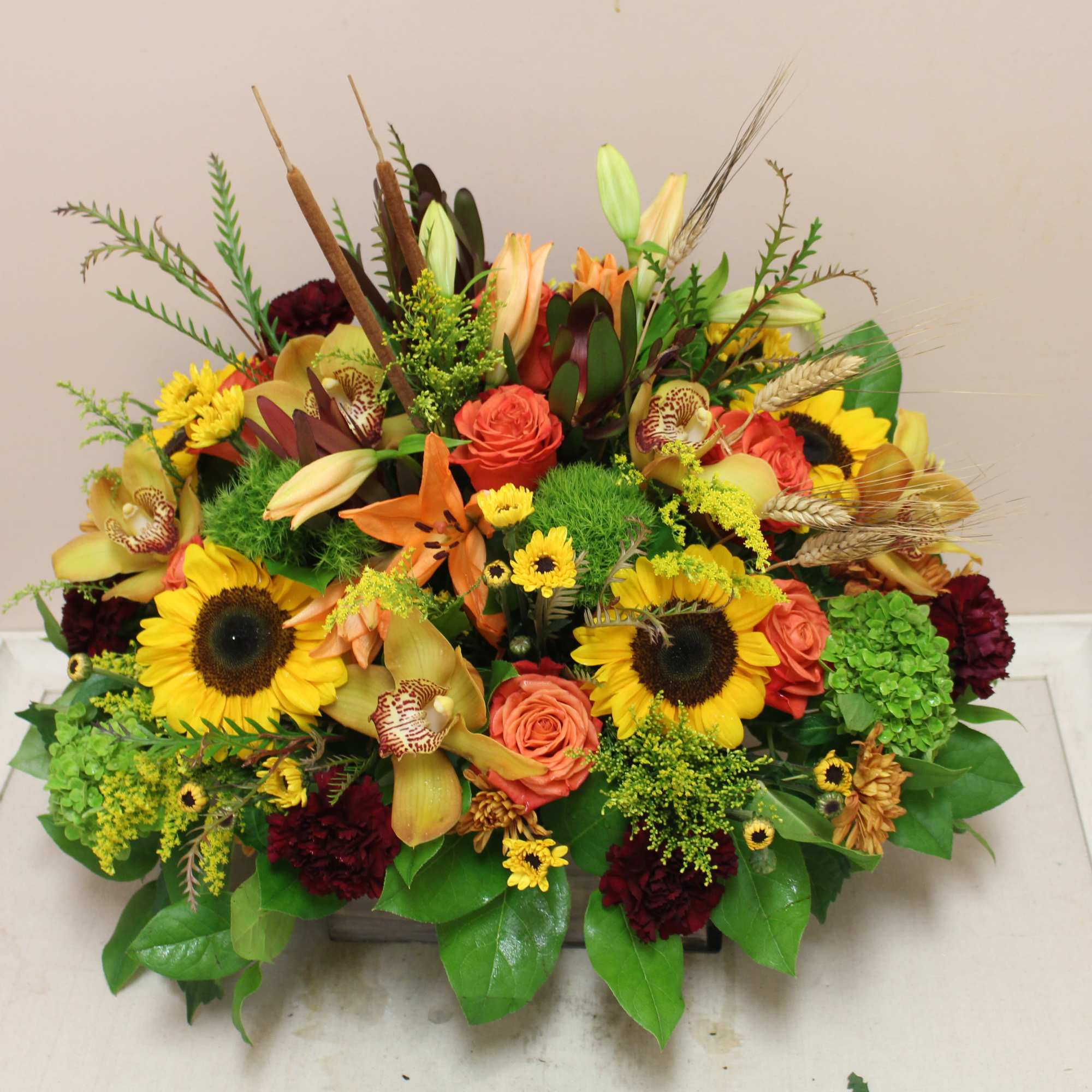 this wooden box is filled to the brim with an autumn arrangement., photo 4 of 4