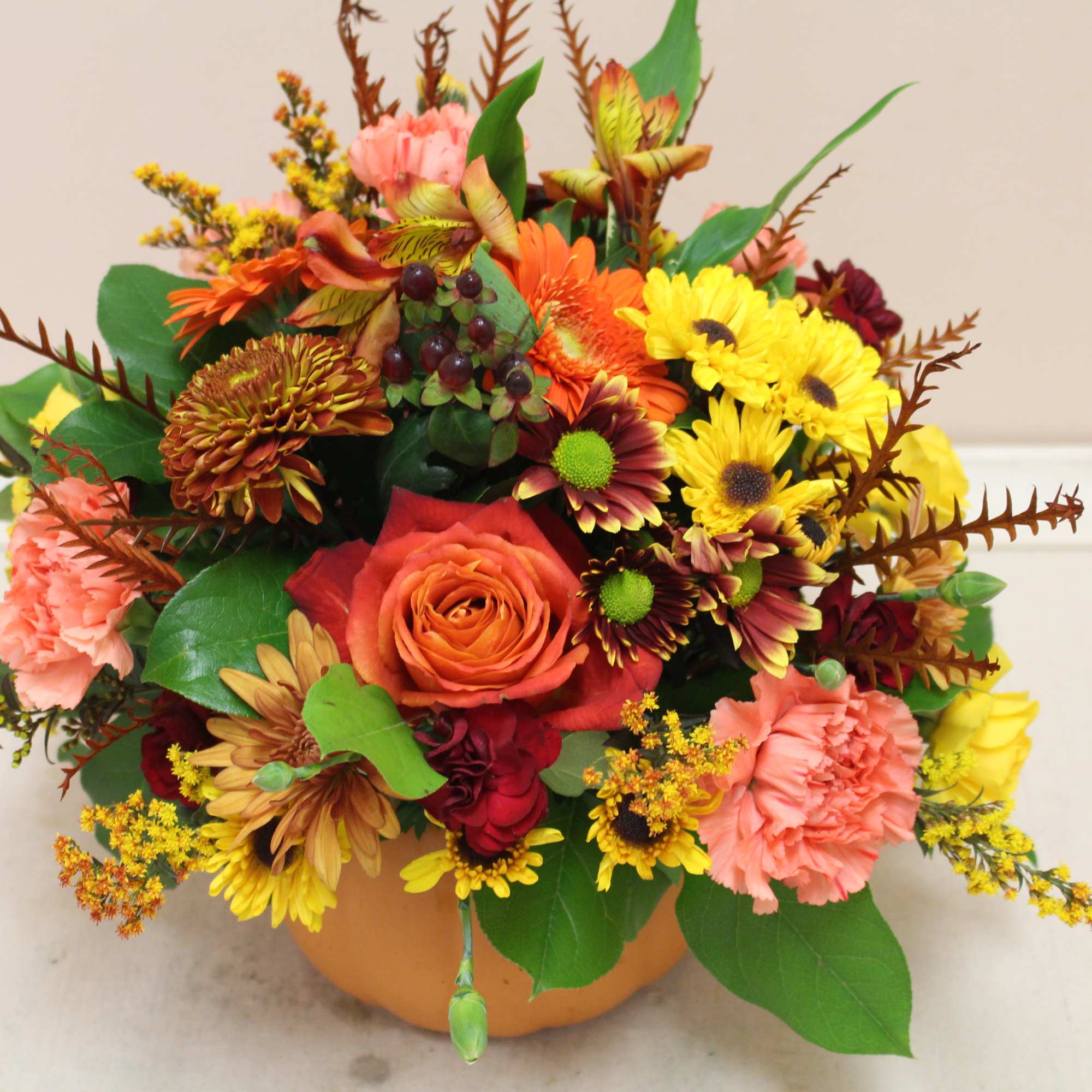 This terra cotta pumpkin is full of roses, poms, spray roses, and, photo 2 of 3