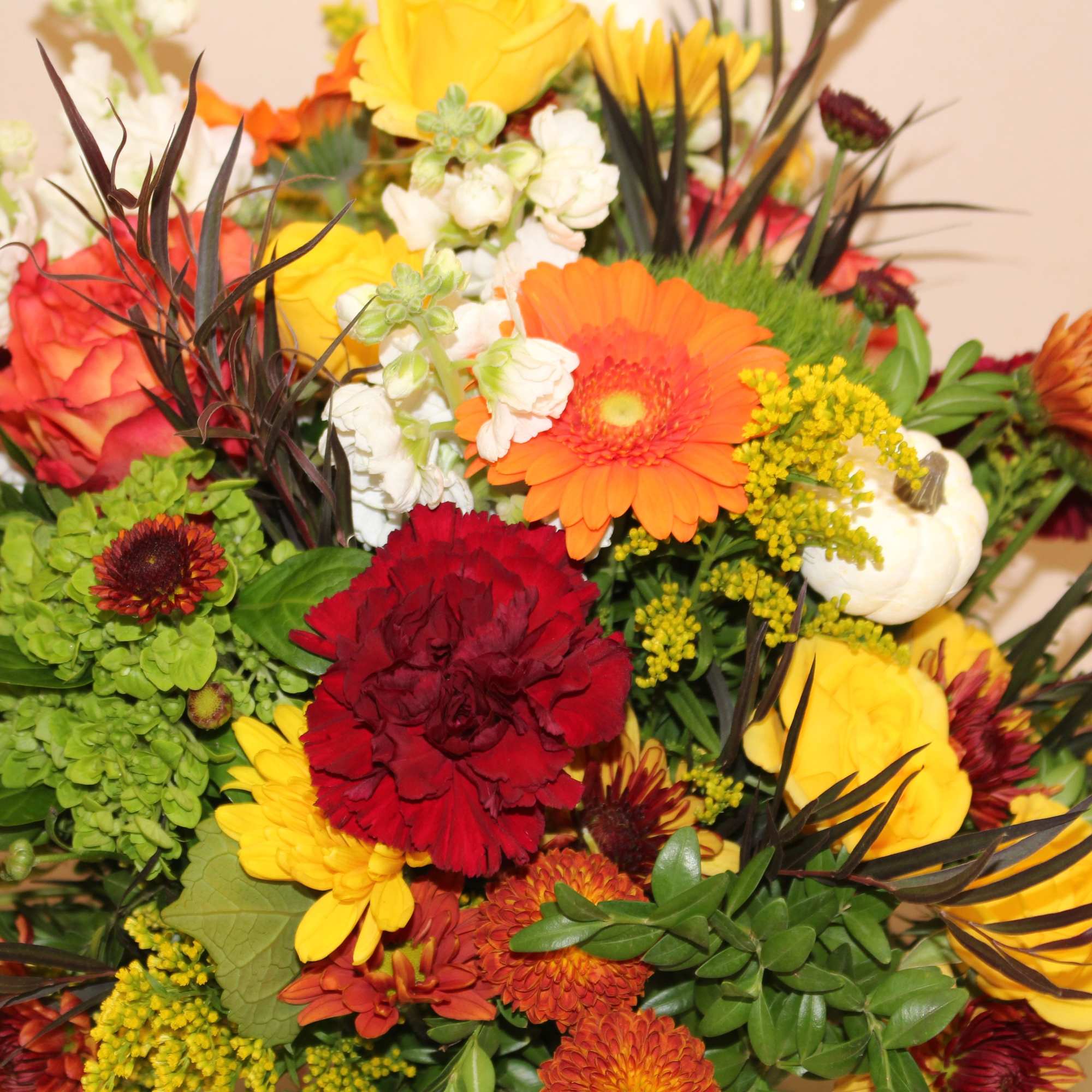 A festive autumn arrangement filled with an array of flowers including gerberas, photo 3 of 4