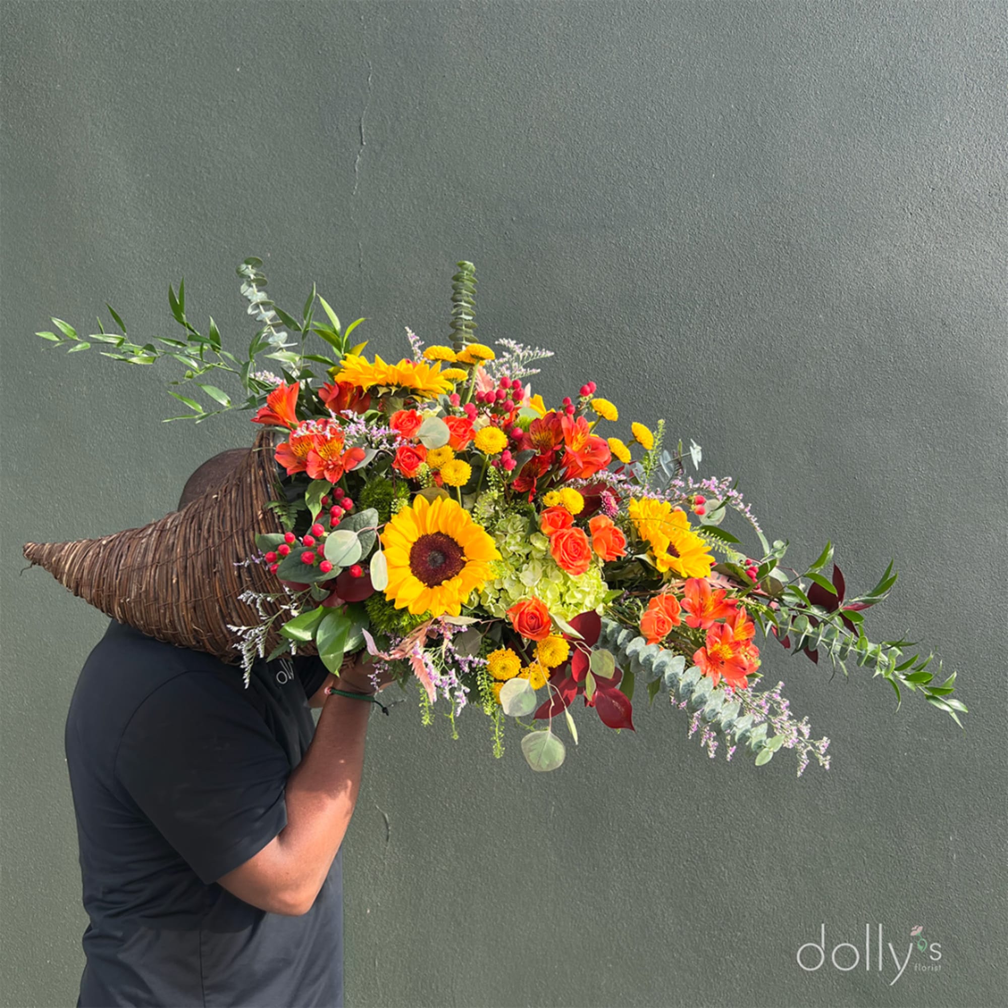 Large colorful bouquet with sunflowers, orange roses, and alstroemeria