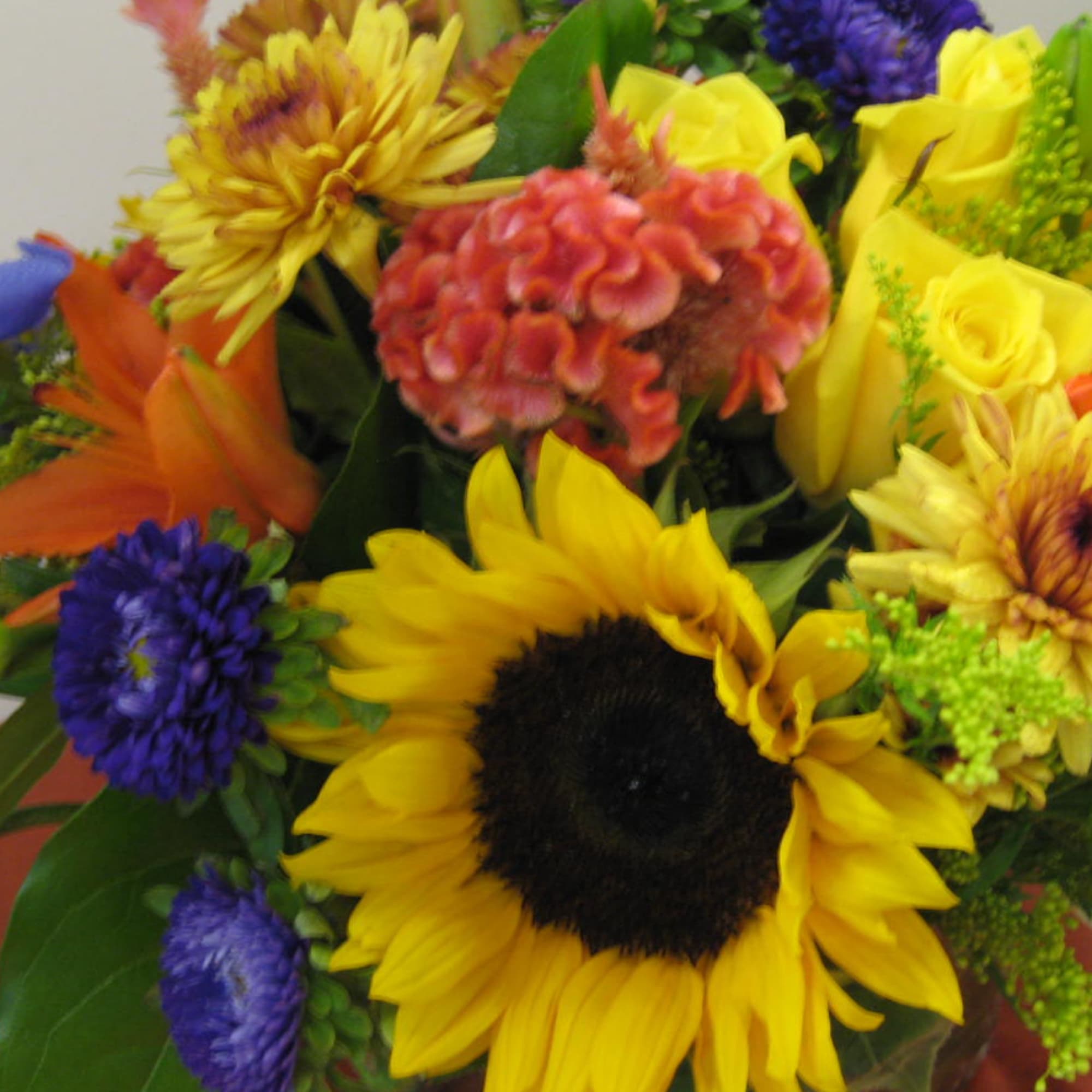 Colorful bouquet with sunflowers, roses, and mixed blooms