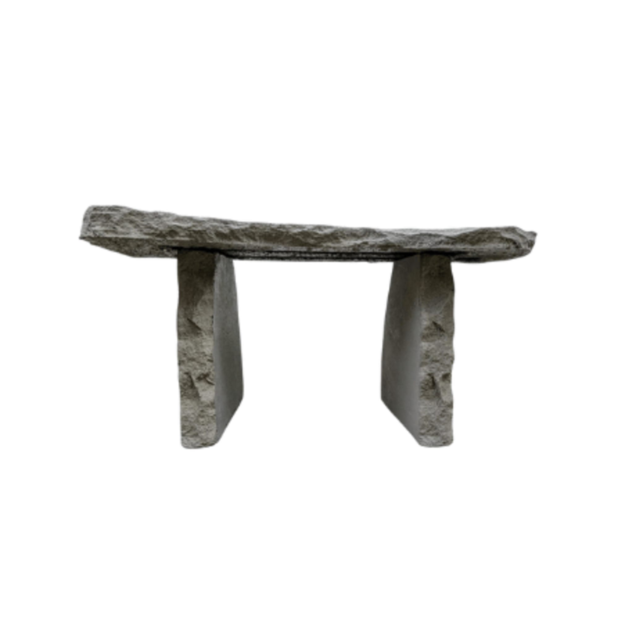 Stone bench with a rough rectangular top and two slab legs