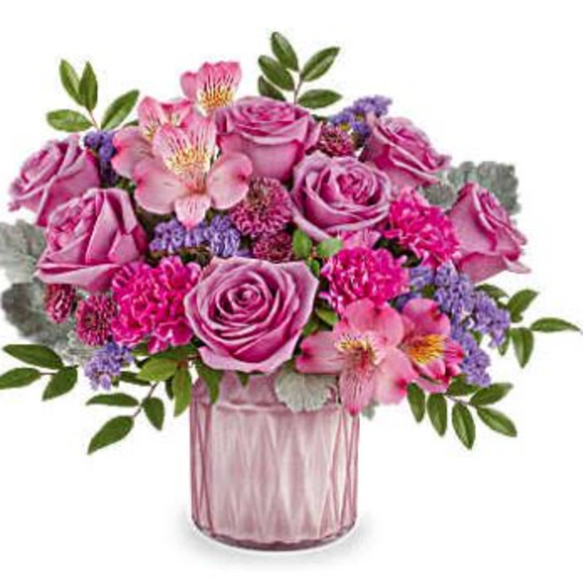 Pink roses and alstroemeria in a pink glass vase
