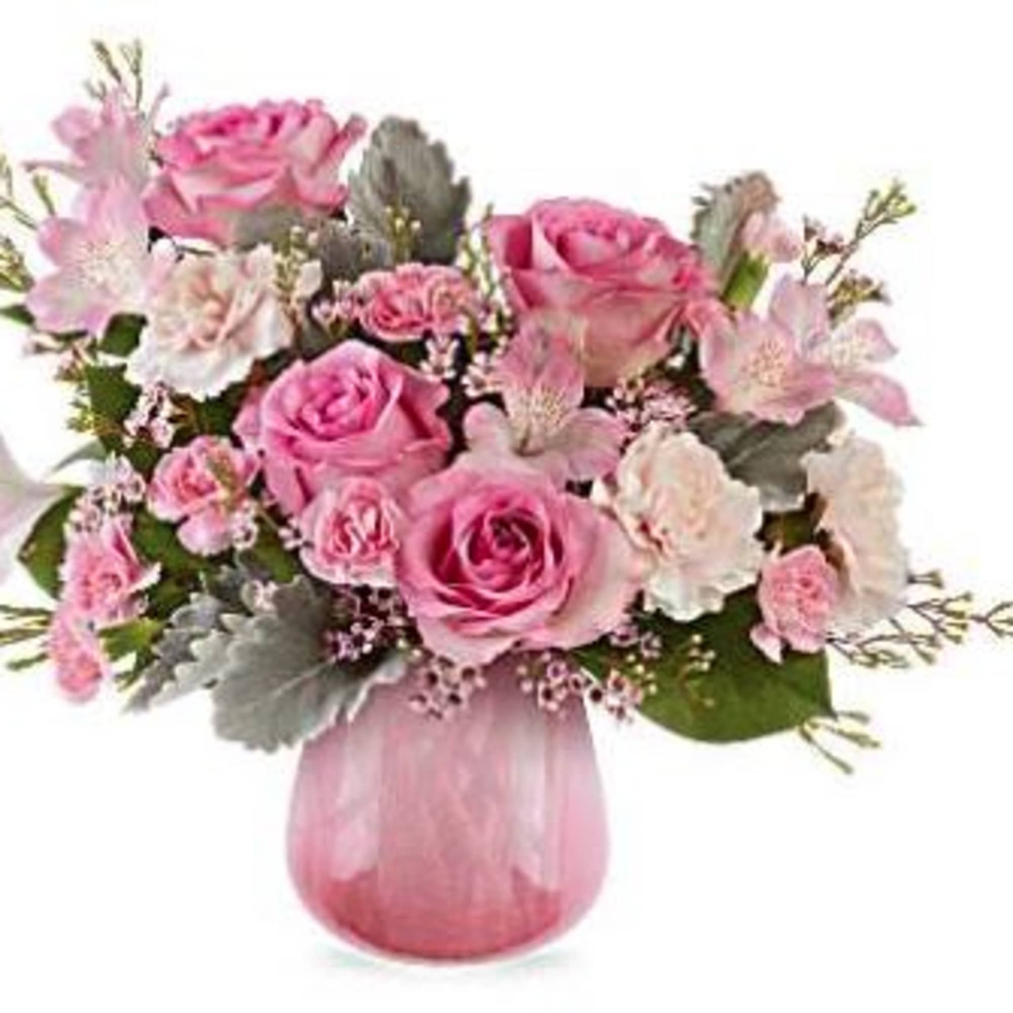 Pink roses and carnations in a pink glass vase