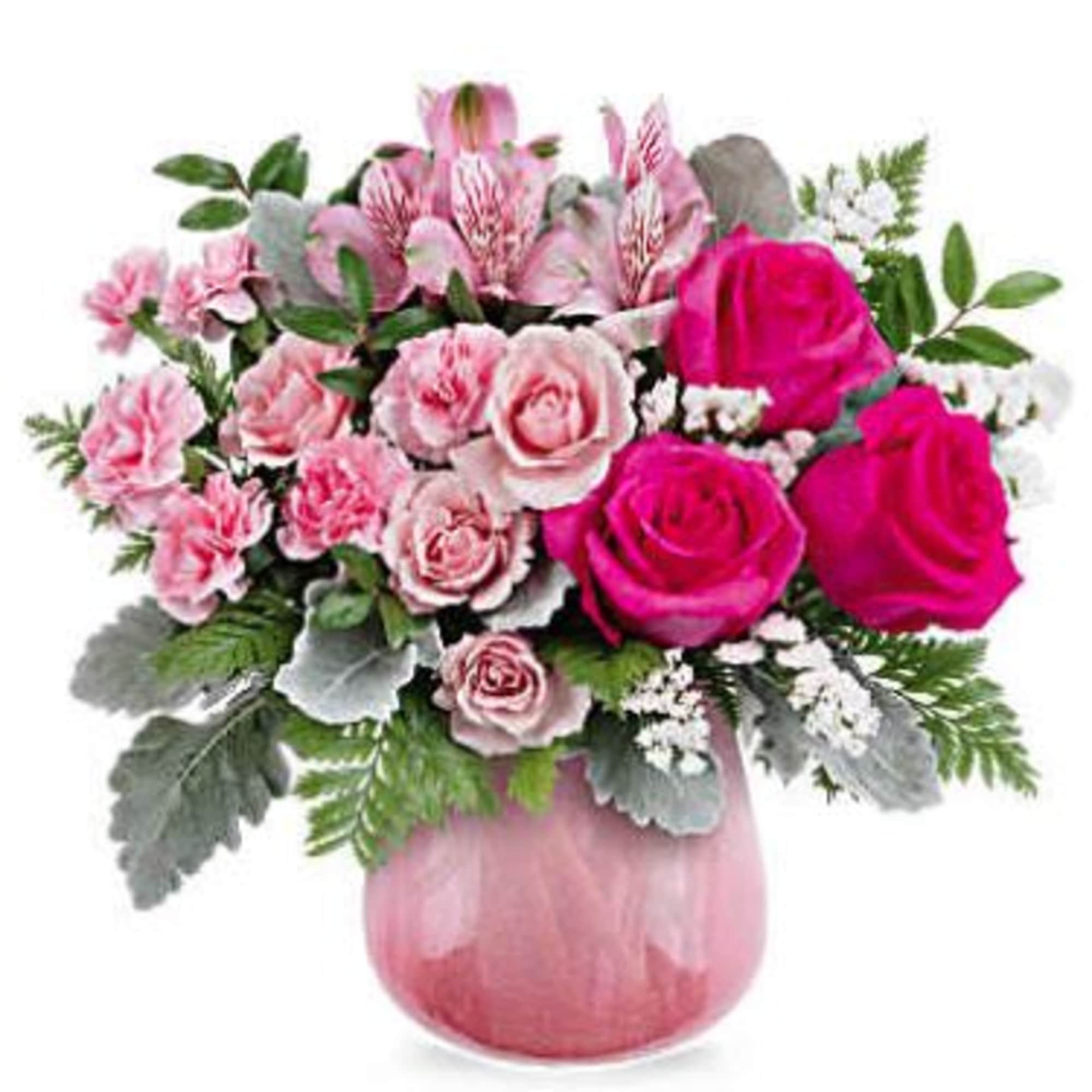 Pink and hot pink roses with carnations in a pink vase